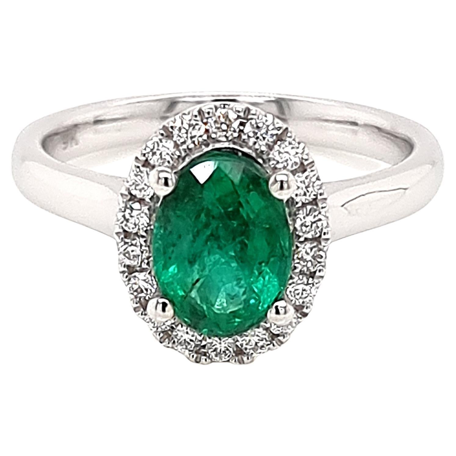 Zambian Emerald Halo Ring with White Diamonds made in 9K White Gold For Sale