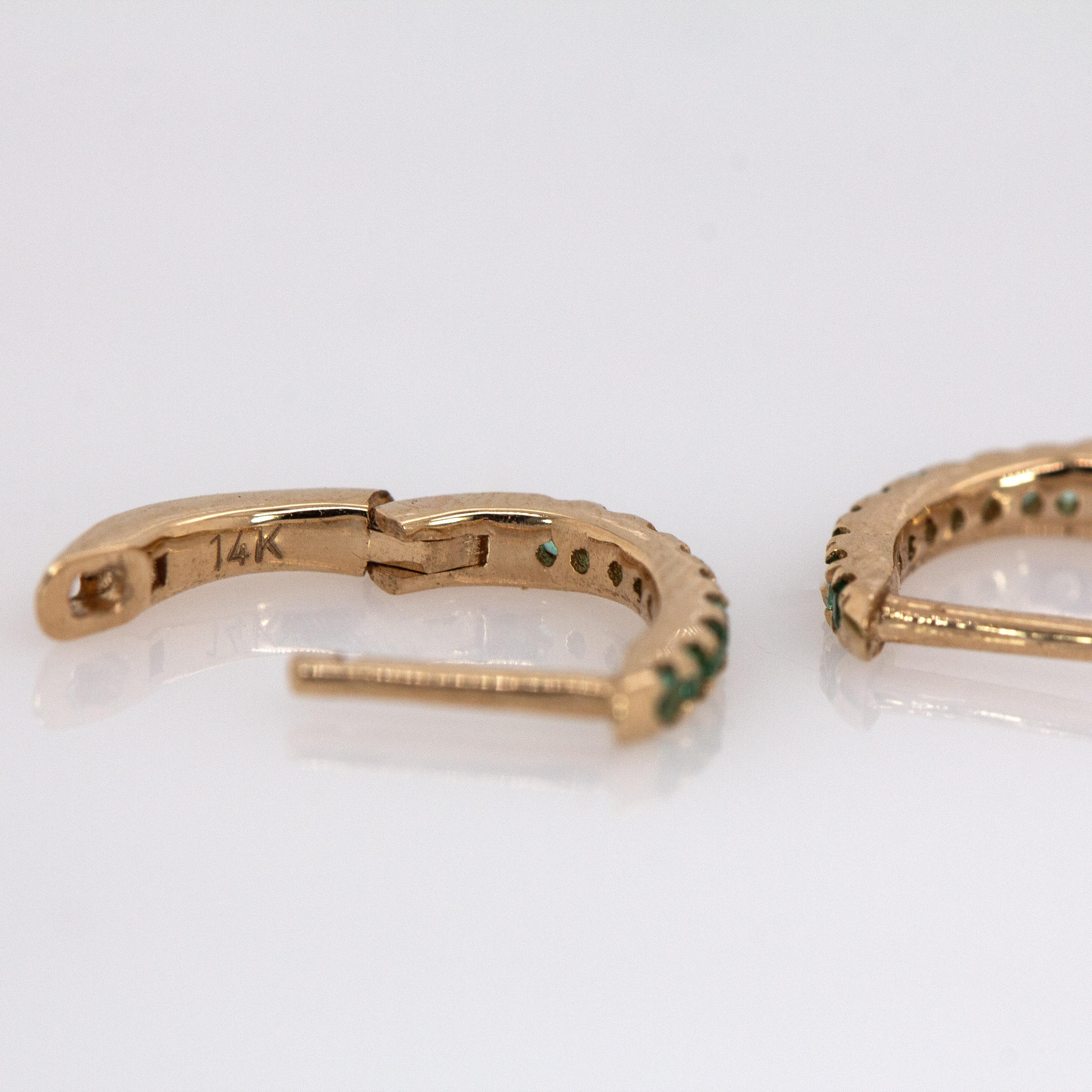 These real 14k yellow gold huggies showcase natural Zambian emeralds in a sleek, minimalist design. Lightweight and timeless, they’re made to go with everything—every day.

Specifications:

Item Type: Earrings
Center Stone: Emerald
Treatment: