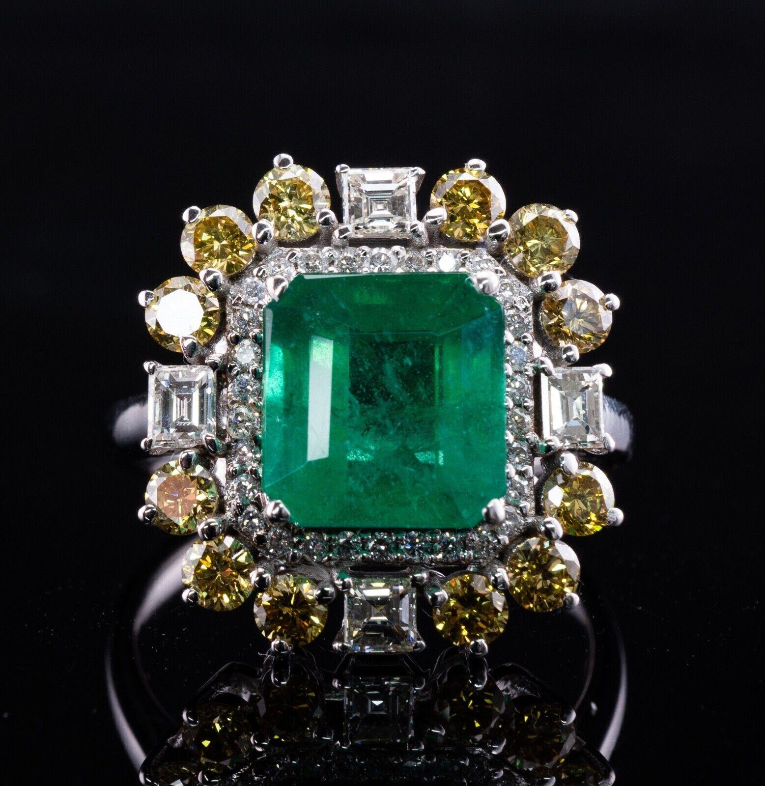 This stunning estate ring is crafted in solid 18K White Gold
The center natural Earth mined Zambian Emerald measures 9x8.5mm (appr. 3.10 carats by calculation).
This is a gorgeous vivid color stone.
It is accented with 30 round brilliant cut