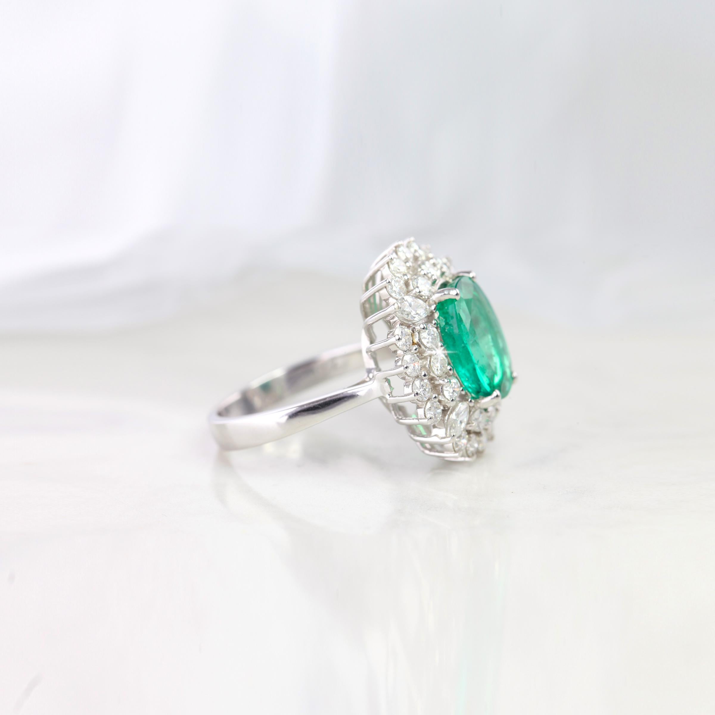 Emerald Entourage Ring, Zambian Emerald With Diamond Ring ,Fine Jewellry Engagement Ring created by hands from ring to the stone shapes. 

I used brillant diamonds to reveal oval cut emerald. I completed these in 18K solid excelent white gold ring.