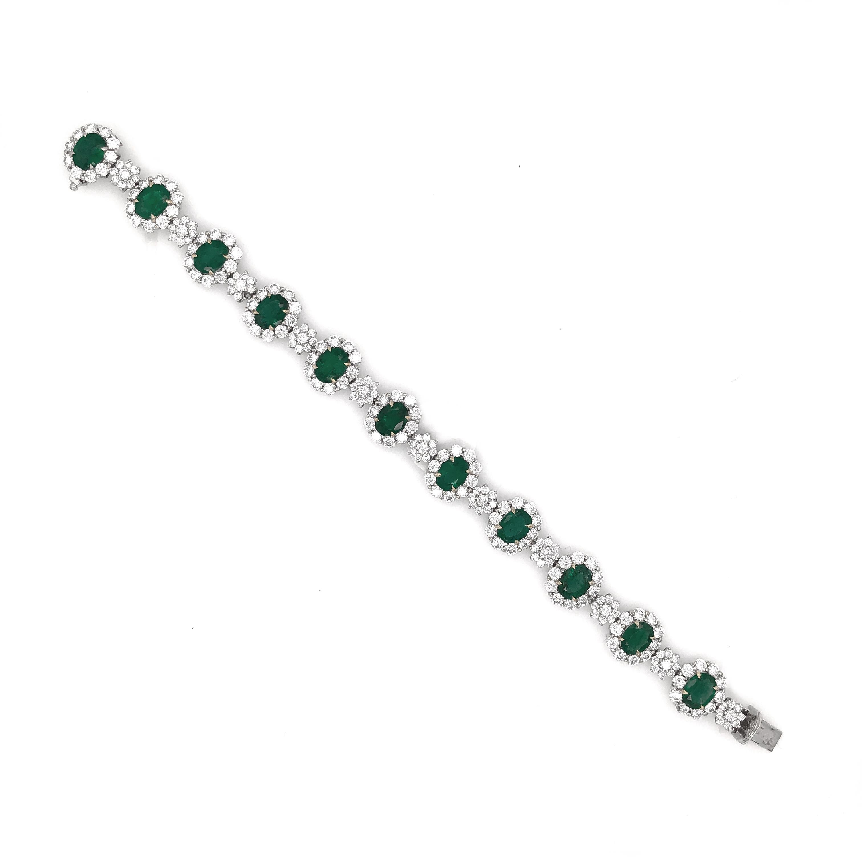 A beautiful emerald and diamond platinum bracelet. 
Stunning oval cut green emeralds 11.82 ct in total. 
Accented by white natural diamonds 10.77 ct in total. 
Diamonds are all natural in G-H Color Clarity VS. 
Platinum 950.
This a stunning,