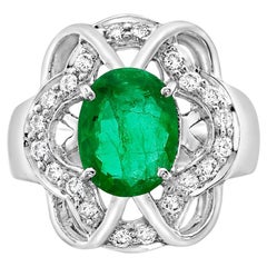 Zambian Oval Shaped Emerald Ring With VS Diamonds Made In 18K White Gold
