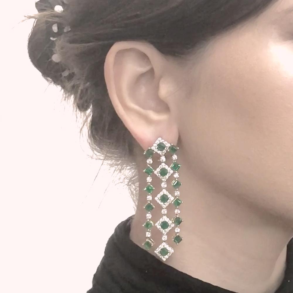 Gorgeous chandelier earrings in 18 karat gold.
Adorned with Zambian square cut green emeralds in 11.09 carat total.
Accented by white round diamonds 5.02 carat total.
Diamonds are natural and in G-H Color Clarity VS. 
French / Omega clips. Vintage