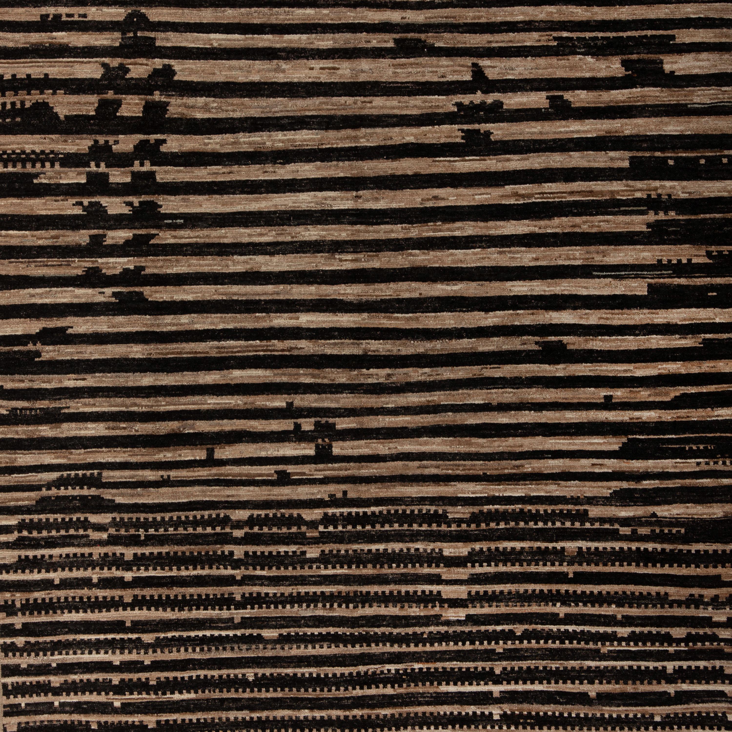 Inspired by the grounding foundations of Earth's natural colors and pure materials, this Zameen Black and Brown Striped Modern Wool Rug - 7'9