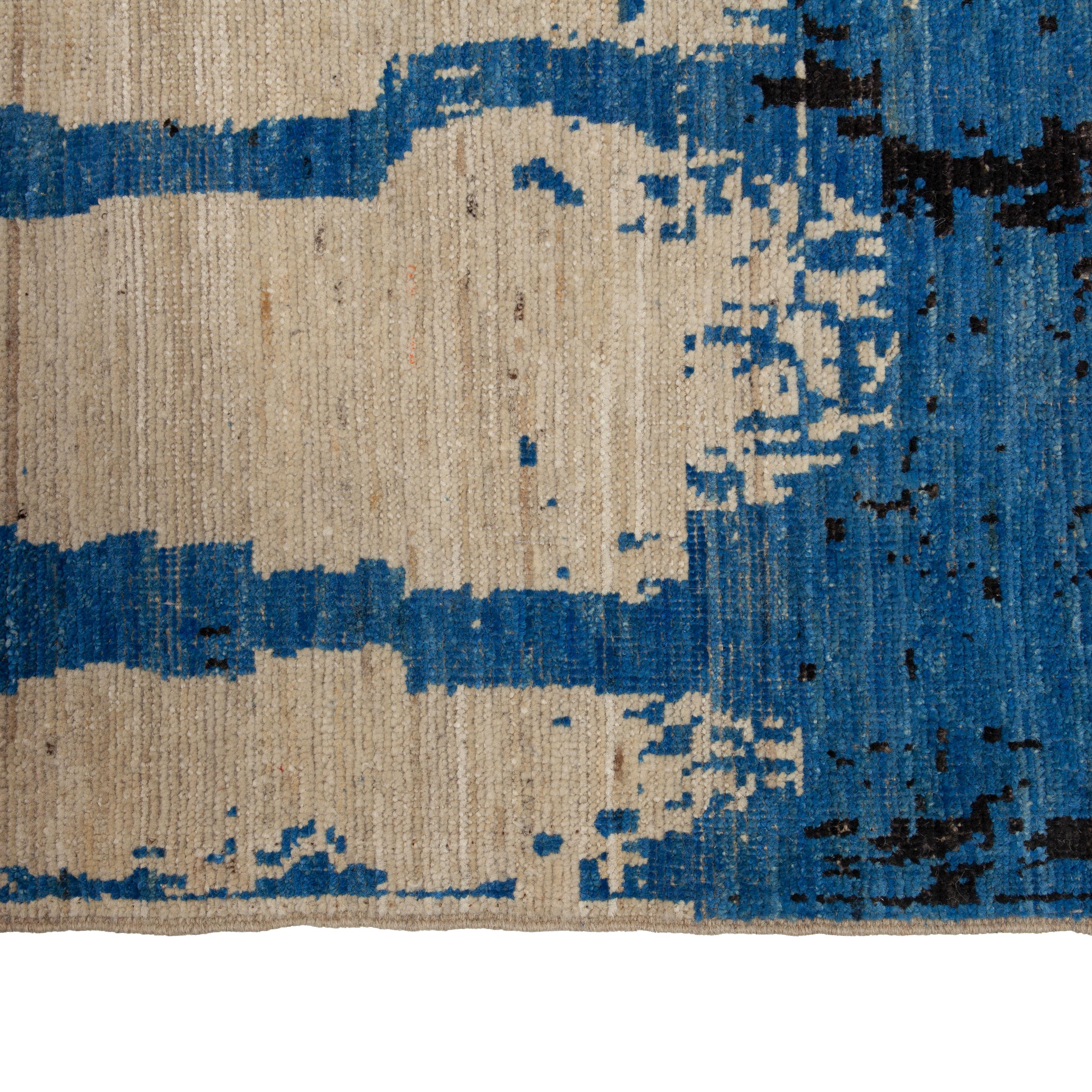 Inspired by the grounding foundations of Earth's natural colors and pure materials, this Zameen Blue and Black Modern Wool Rug - 12'3