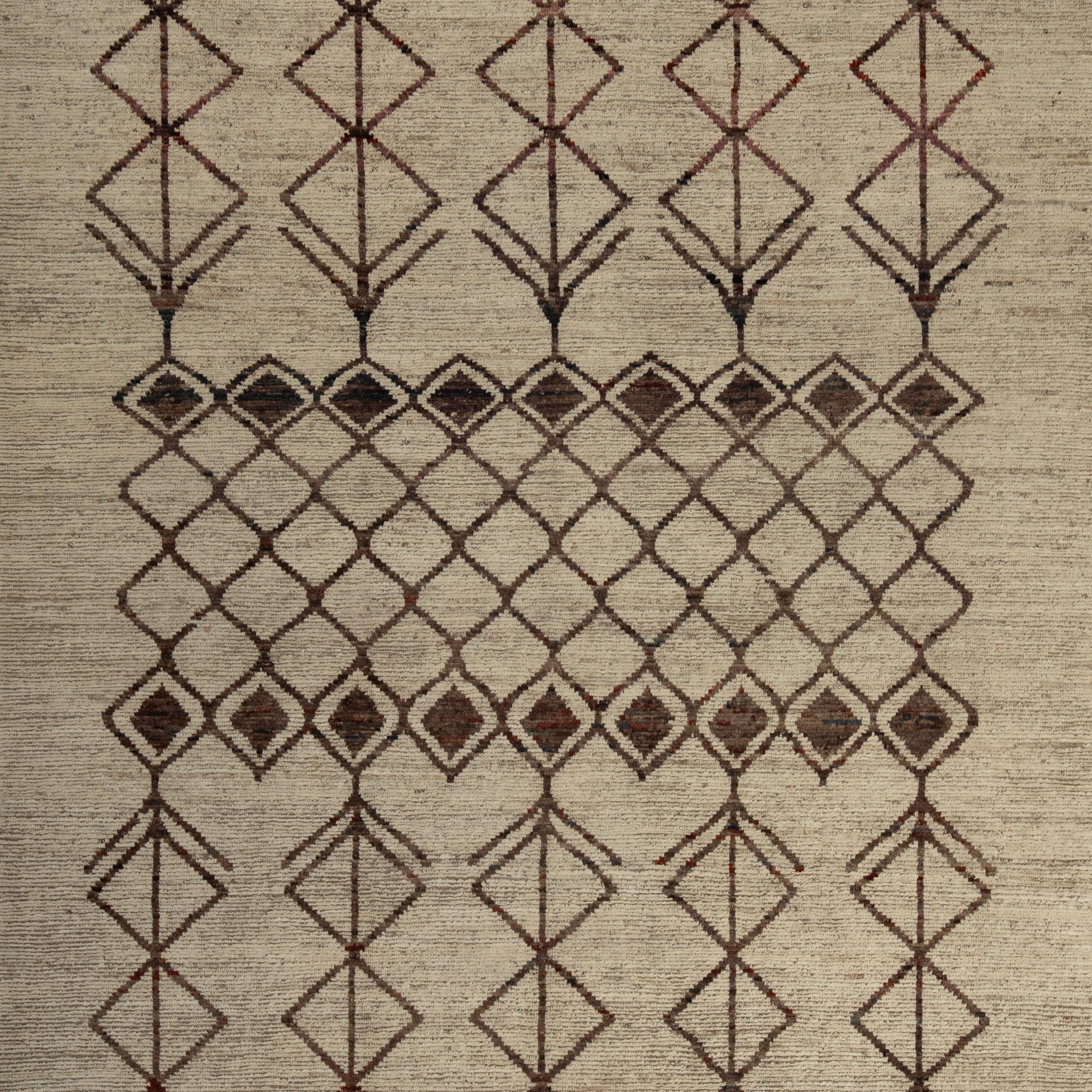 Inspired by the grounding foundations of Earth's natural colors and pure materials, this Zameen Brown and Beige Tribal Wool Rug - 8'11