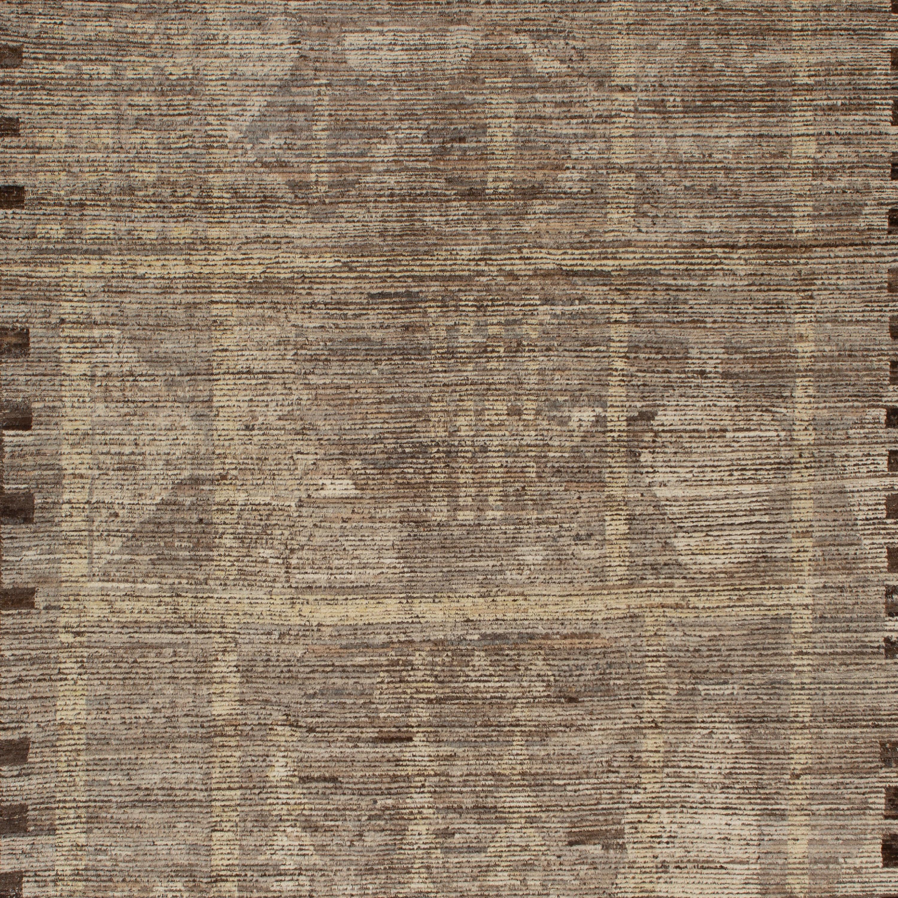 Inspired by the grounding foundations of Earth's natural colors and pure materials, this Zameen Brown Distressed Tribal Wool Rug - 9'3
