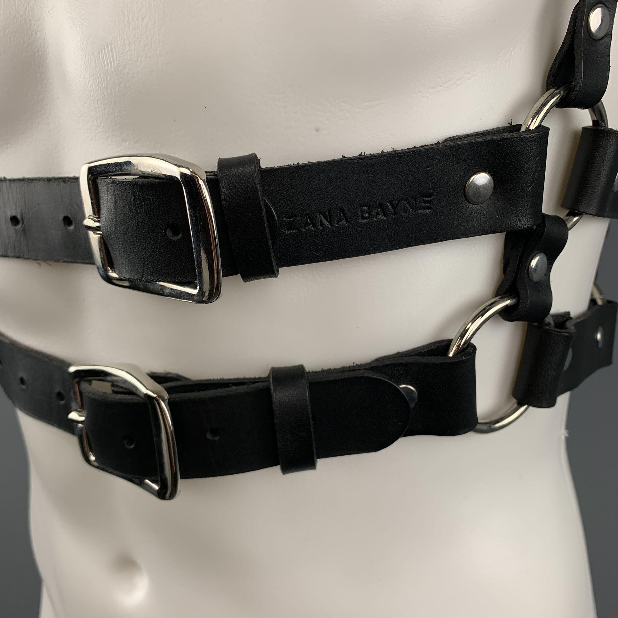ZANA BAYNE harness comes in black leather with silver tone hardware, double waistband, and studded back 