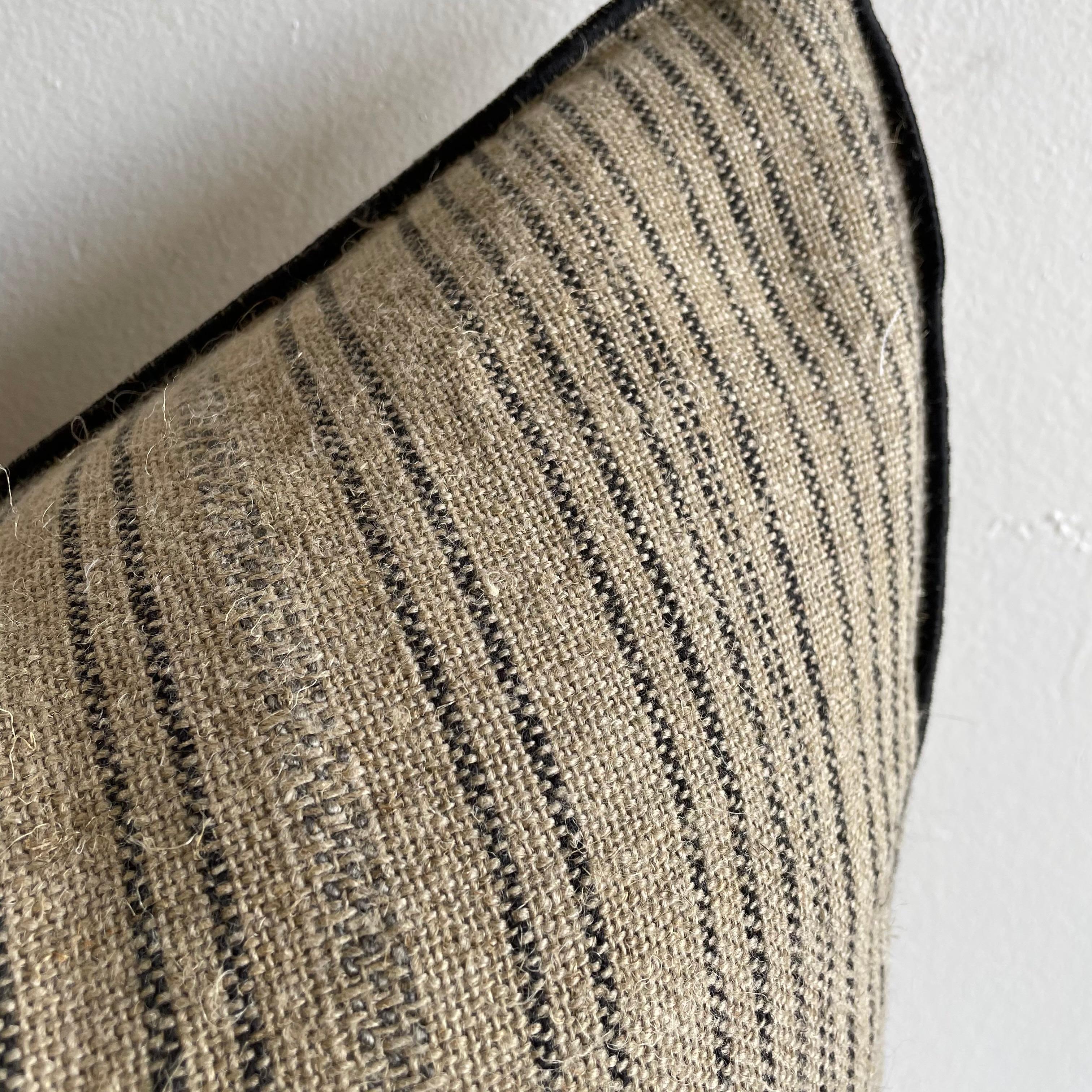Custom linen blend accent pillow. Color: A black/ natural linen colored nubby textured style pillow with a stitched edge, metal zipper closure. Our pillows are constructed with vintage one of a kind textiles from around the globe. If this item is