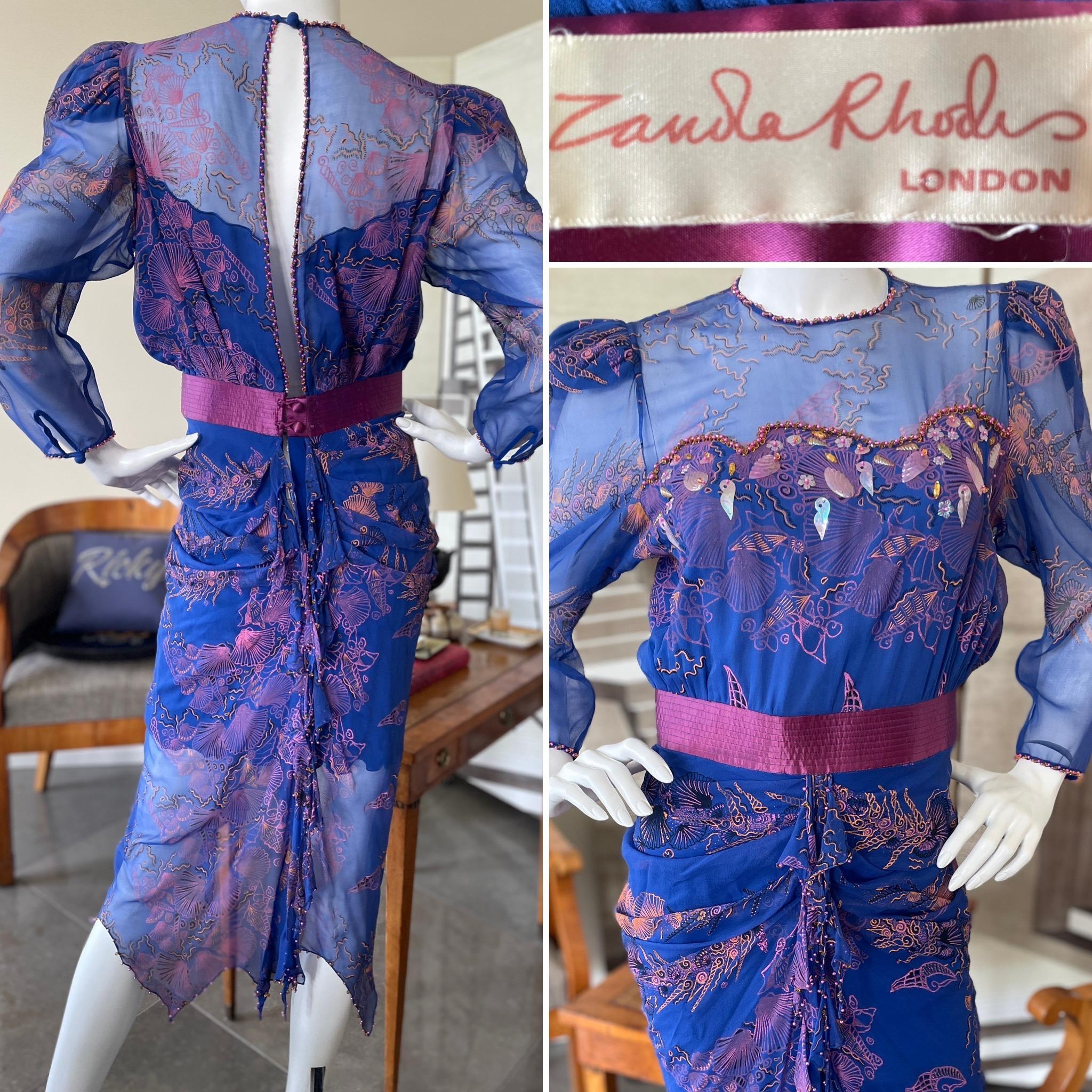 Zandra Rhodes 1970's Seashell Pattern Silk Chiffon Dress w Pearl & Crystal Trim.
Keyhole back with ruffles trimmed in crystal and pearls.
No size label (M)
Bust 39
