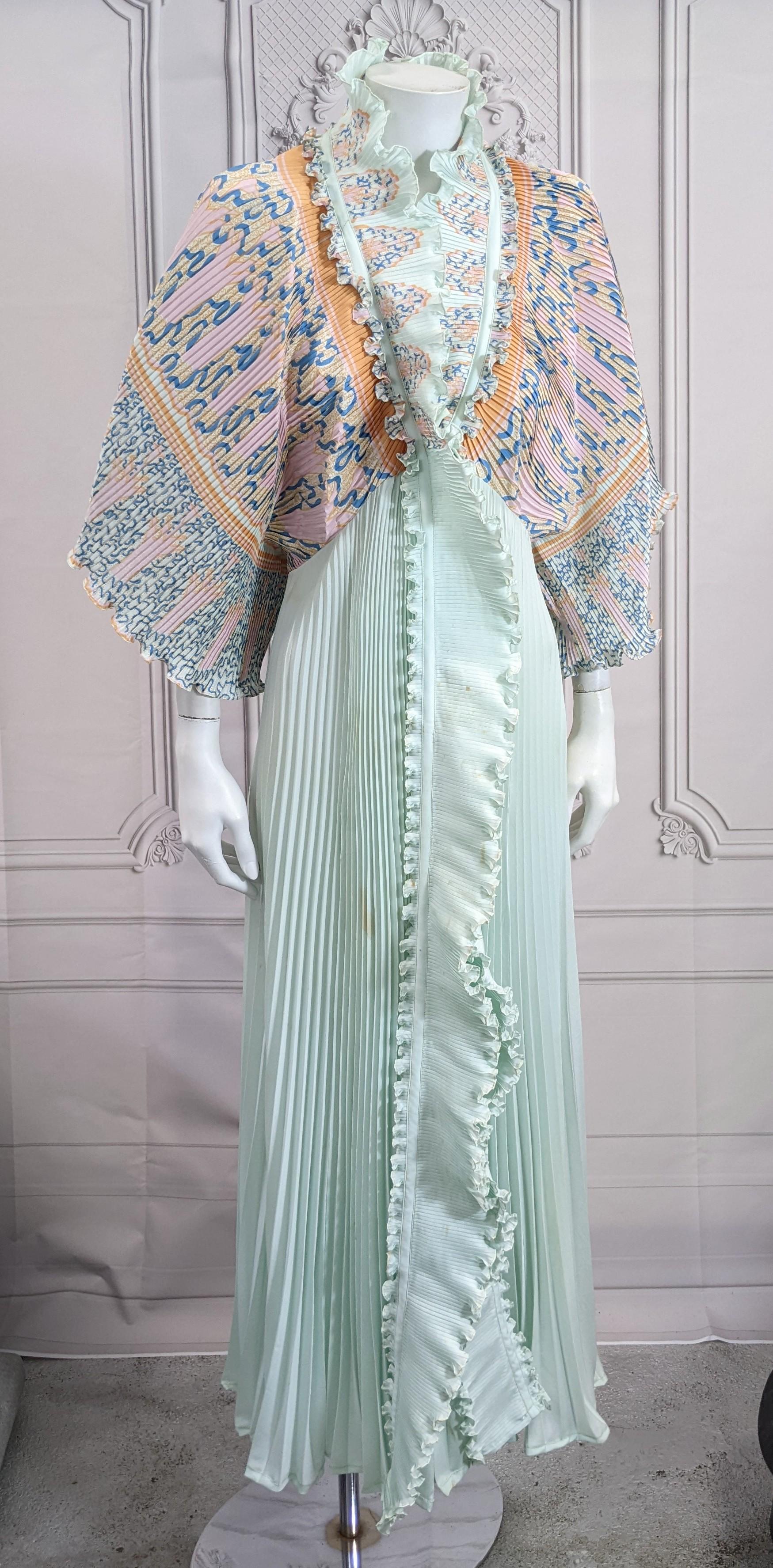 Zandra Rhodes Extravagant Pleated Robe from the 1970's with her signature abstract and Orientalist designs. Fully pleated with large kimono sleeves and full skirt. 
Originally designed as loungewear but now commonly used for day and evening wear.