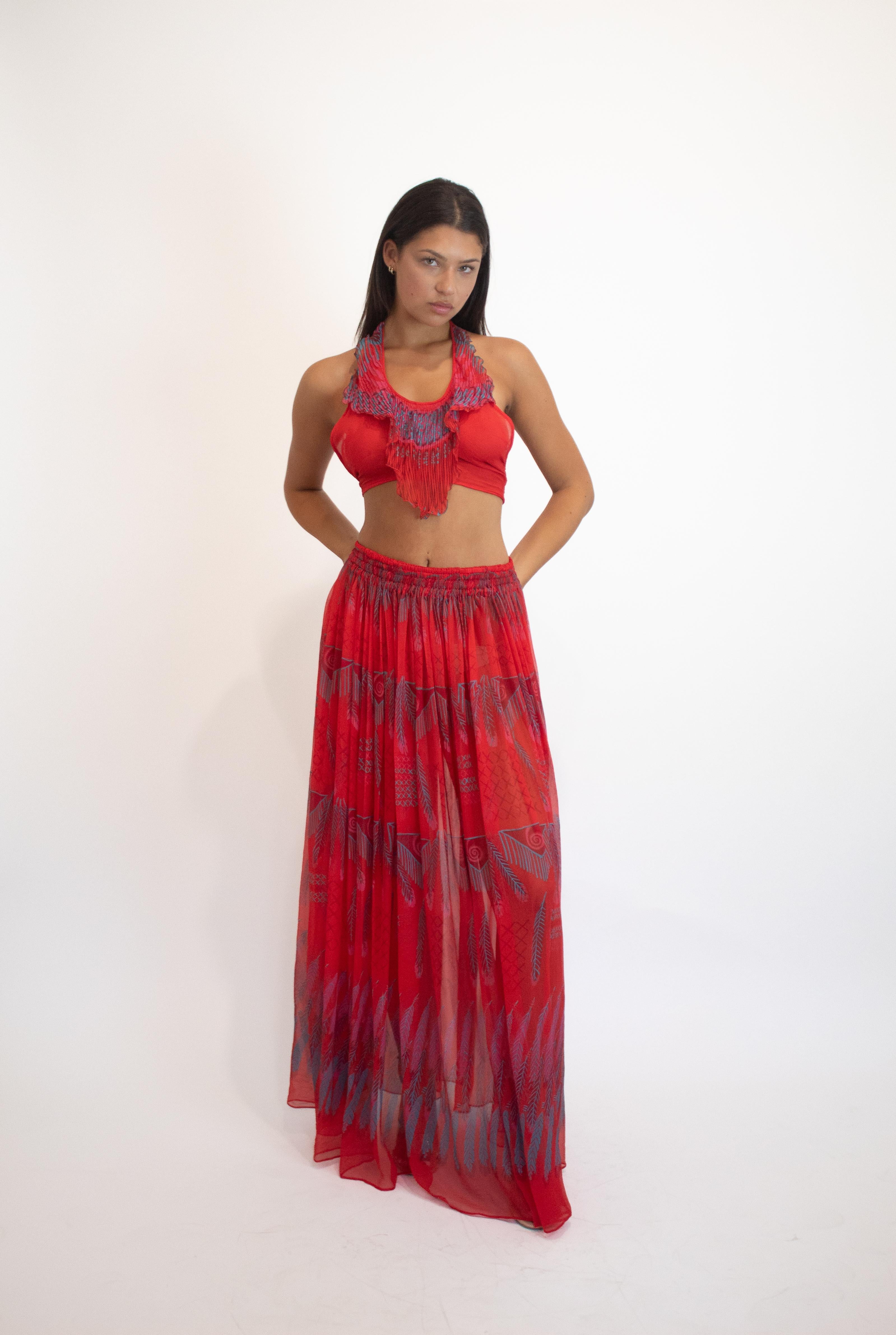 Elevate your summer wardrobe with the Zandra Rhodes F/W 1970/71 Red Silk Chiffon Set, featuring a vibrant Indian Feather' and Triangle' print that captures an exotic, vacation-ready spirit. Crafted from luxurious silk chiffon, this set offers