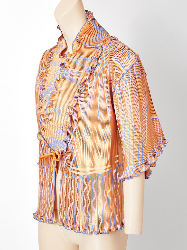 Zandra Rhodes, pinkish rose tone, three quarter sleeve jacket-top with her signature pattern in bright blue and ivory. Jacket has vertical plissé detail with a 