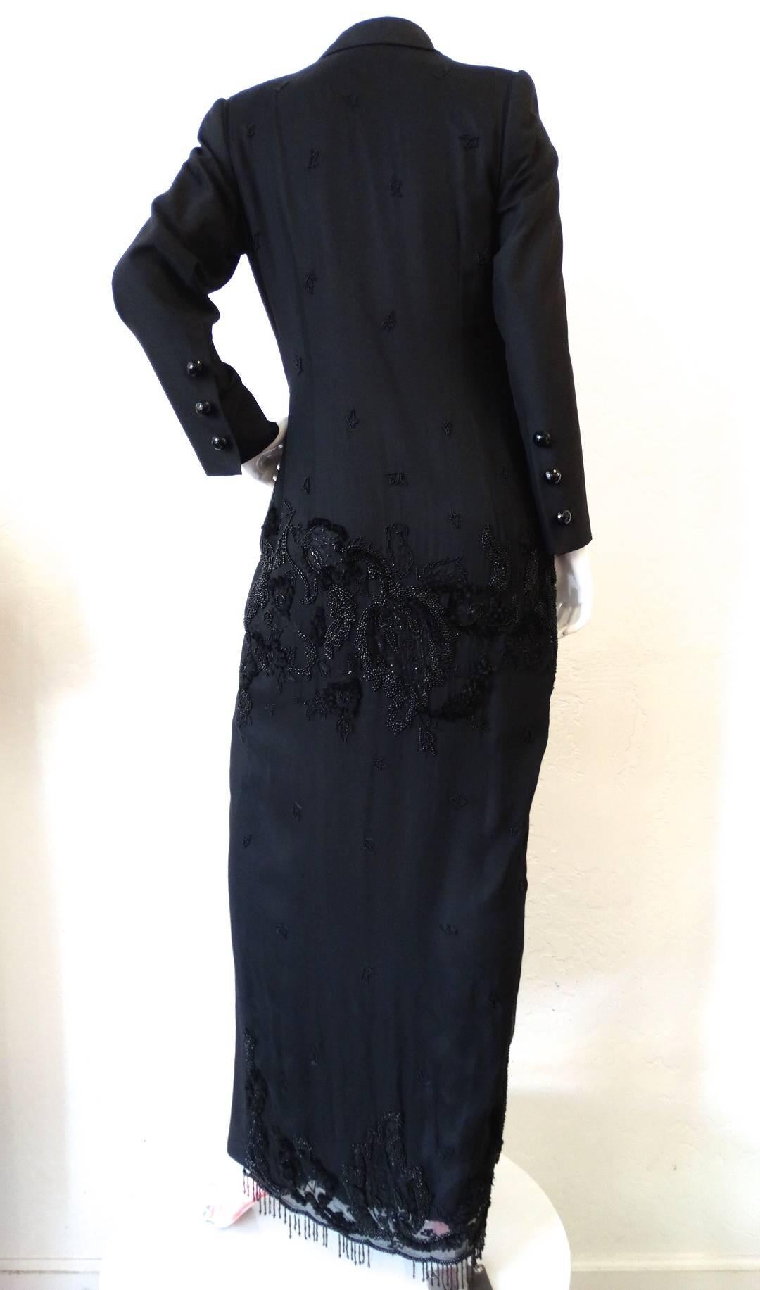 Avant garde coat dress from Malaysian designer Zang Toi! Extra long wool-silk blend blazer with vintage inspired double breasted construction. Pockets at either side of the hip with oversized flaps. The entire back of this piece is semi sheer, with