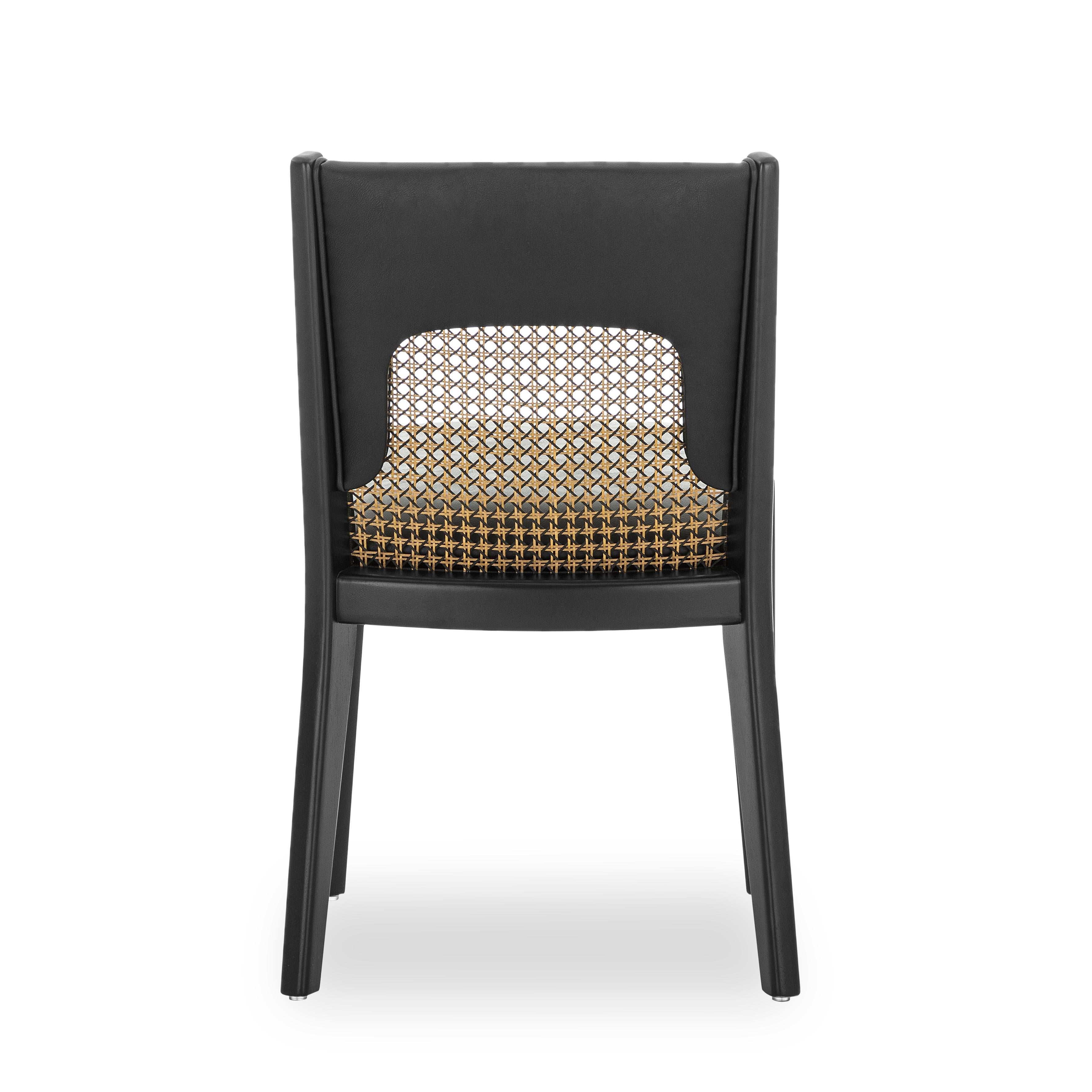 The Zani dining chair is synonymous with style, elegance, comfort, and quality with its black upholstery back and black wood finish. With the Zani chair, Uultis has combined all of these qualities together. A simple cane in the back seat makes a