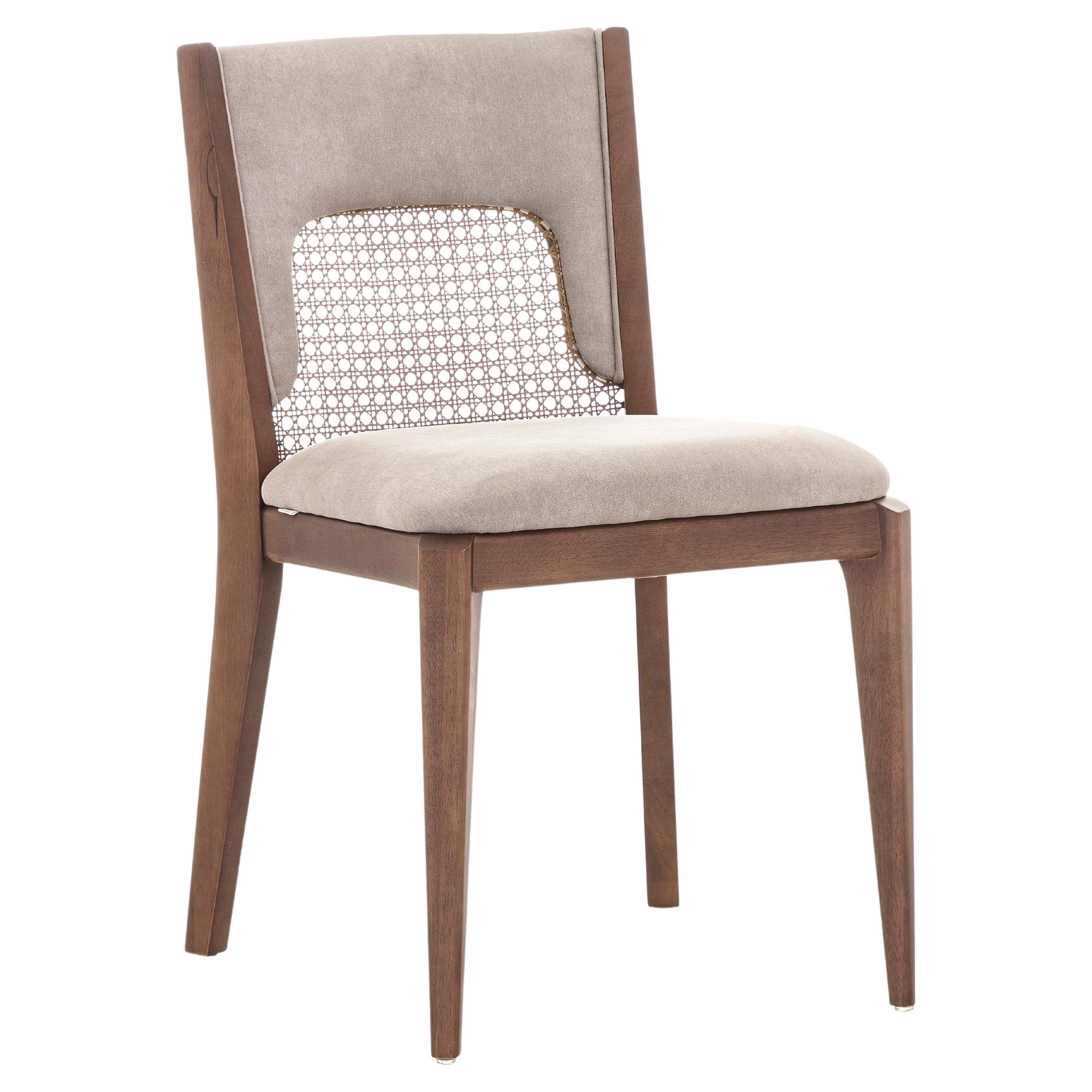 The Zani dining chair is synonymous with style, elegance, comfort, and quality with its light brown upholstery back and walnut wood finish. With the Zani chair, Uultis has combined all of these qualities together. A simple cane in the back seat