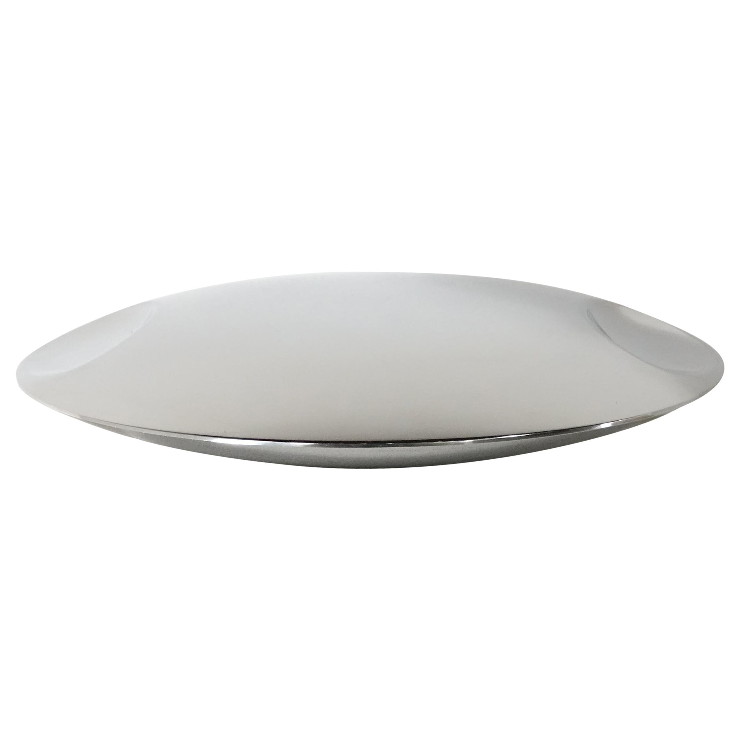 Italian stainless steel plate or bowl by Lino Sabattini for Zani & Zani, 1978.
Marked underneath: Zani & Zani, acciai per la casa, Italy 18/10.
 