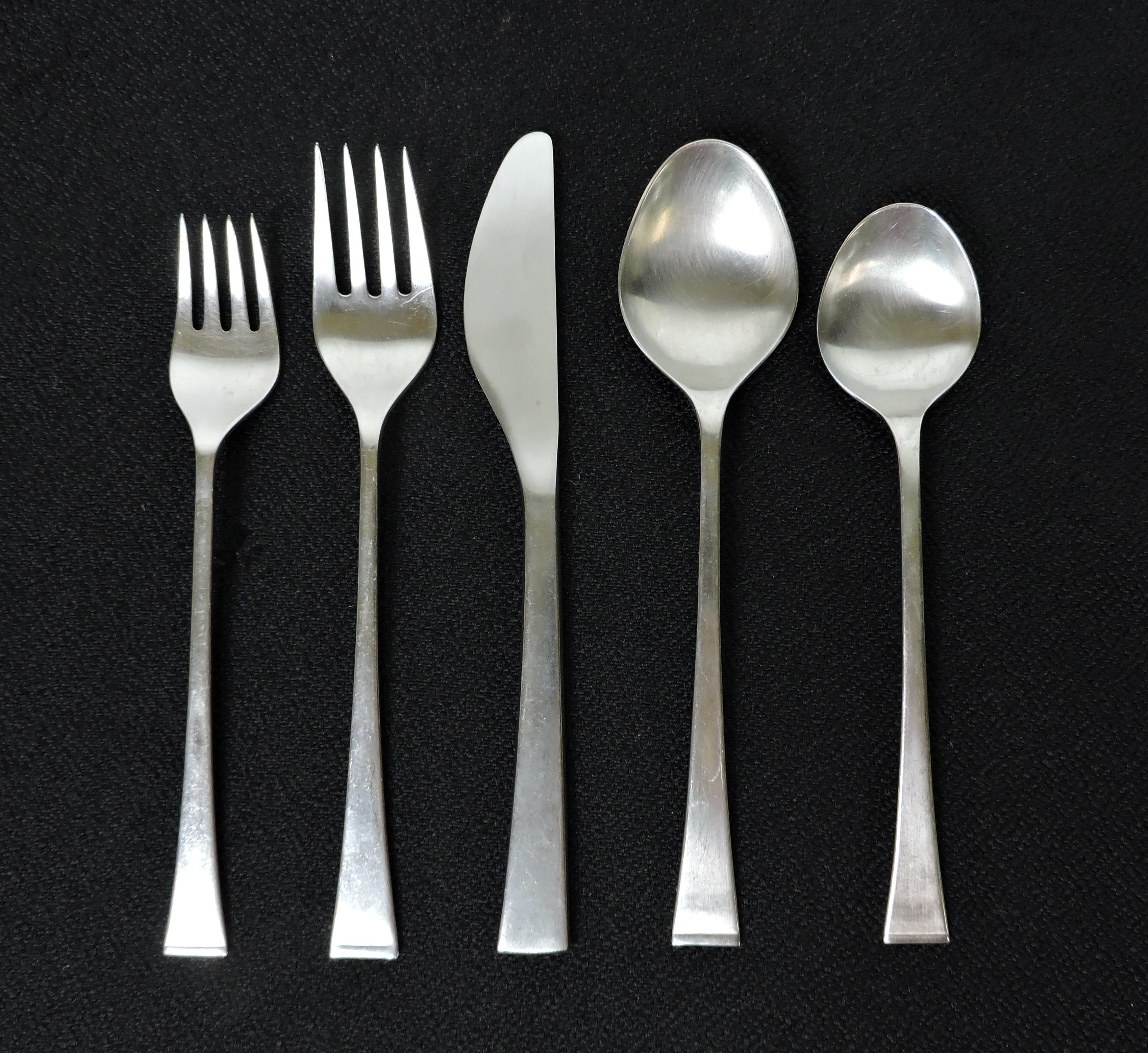 Beautiful and elegant 41 piece, service for eight, stainless steel flatware set in the Sabrina pattern manufactured in Italy by Zani & Zani. Designed by Carla Mencioni and Armando Moleri, a version of this pattern is in the Rhode Island School of