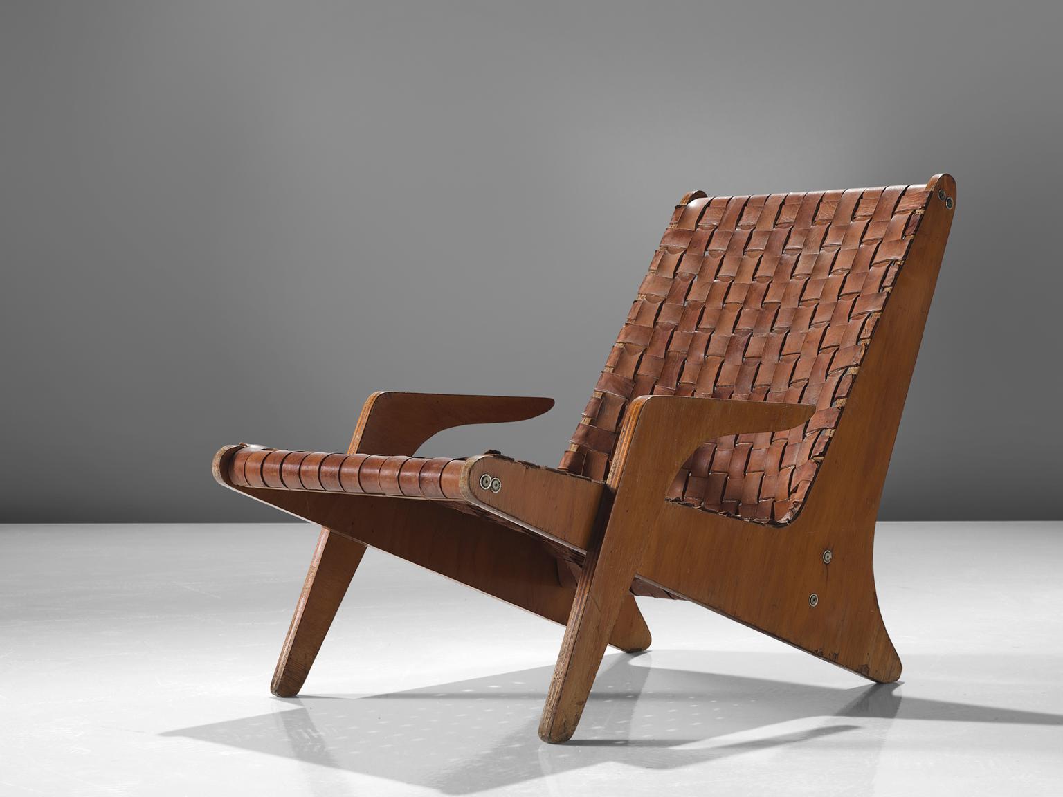Zanine Caldas, Espreguicadeira, plywood and cognac leather, Brazil, 1949.

This sculptural lounge chair is designed by Zanine Caldas. The chair is made out of 20mm thick plywood and cognac leather seat. The chair is one of Caldas' classics with