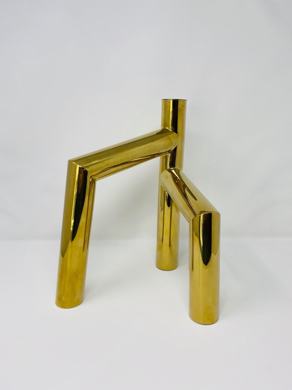 Beautifully sculptural candleholder by Zanini de Zanine. Regarded as one of the most renowned forces in art and design, Zanini de Zanine creates pieces that bring a strong presence in design. This candleholder is a luxurious and sophisticated