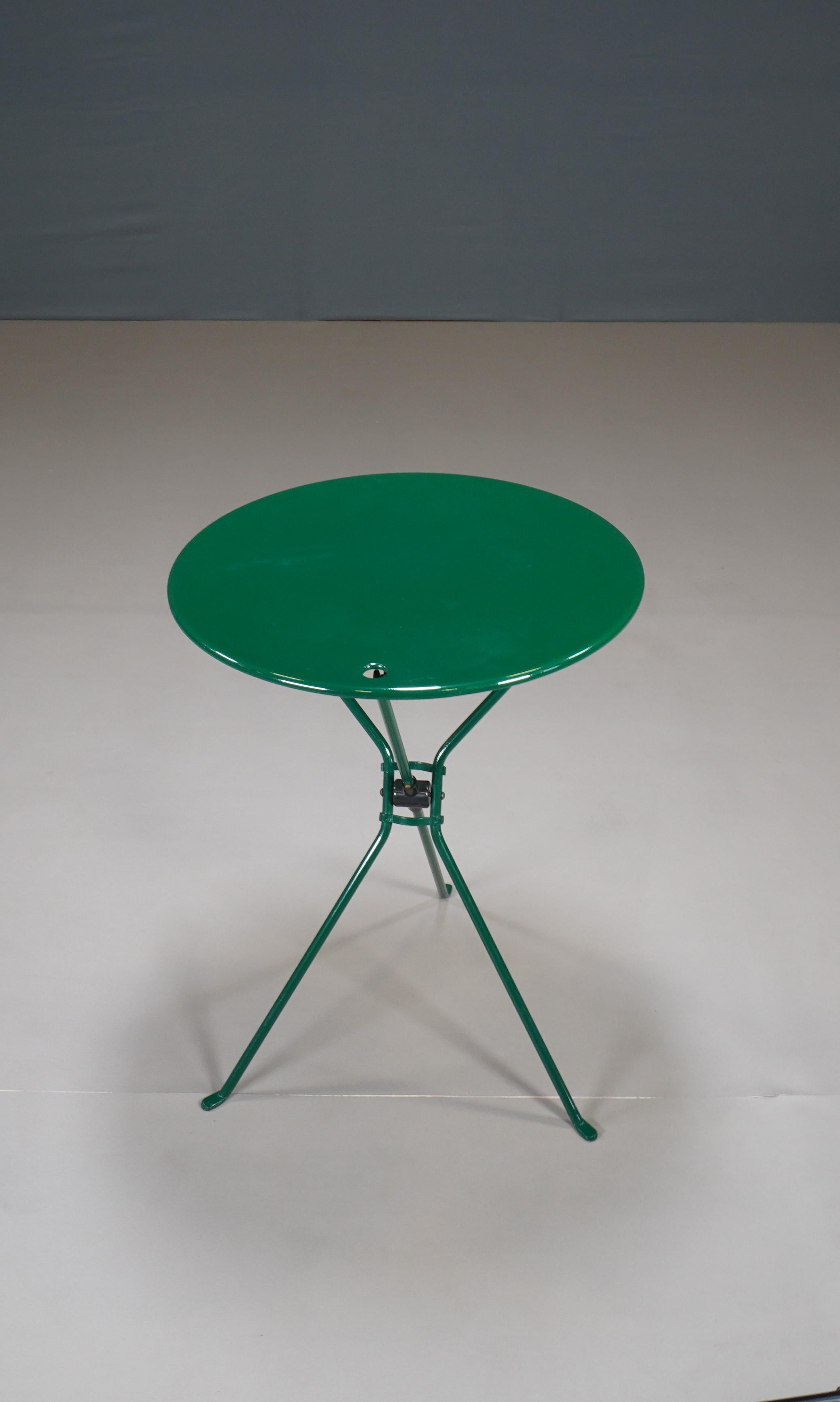 The Cumano Folding Table, designed by Achille Castiglioni for Zanotta in 1970, is a practical and stylish addition to any space. 

Its sleek metal design and folding capability make it perfect for small areas. Ideal for both indoor and outdoor use,