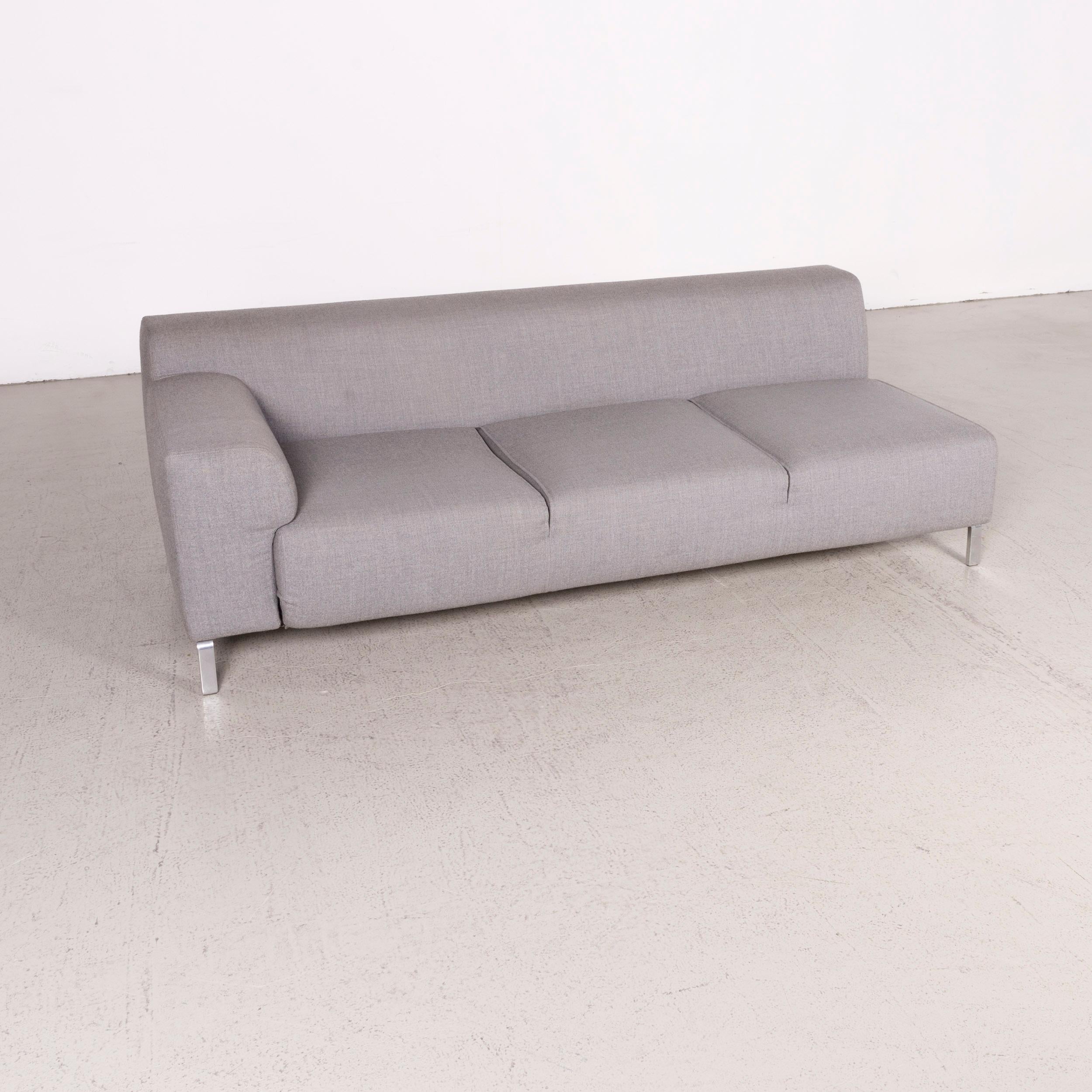 We bring to you a Zanotta Greg designer fabric sofa gray three-seat.

Product measurements in centimeters:

Depth 90
Width 205
Height 67
Seat-height 40
Rest-height 57
Seat-depth 60
Seat-width 180
Back-height 30.
  