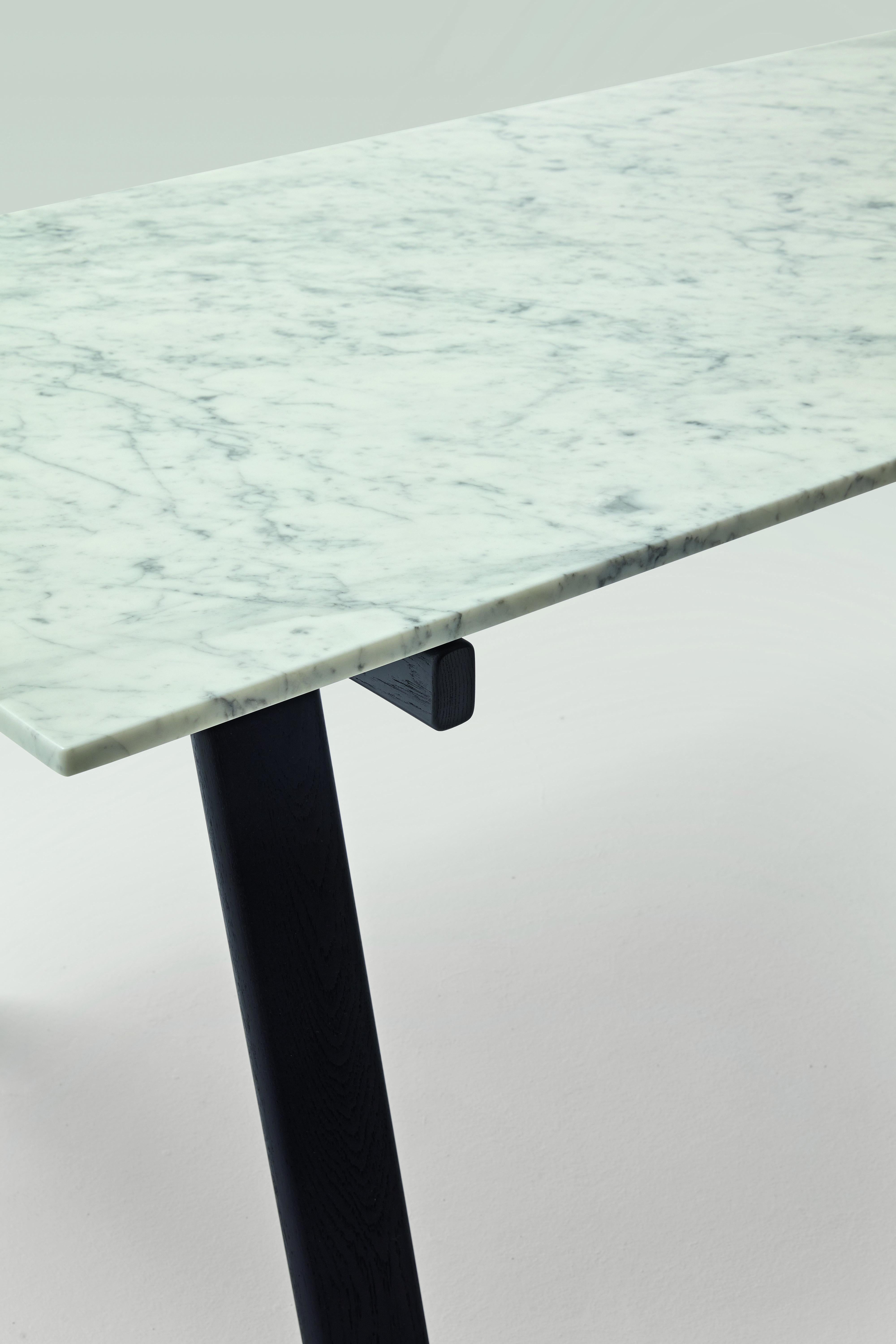 Zanotta Large Ambrosiano Table in Carrara Marble Top with Black Frame by Mist-o

Trestles in solid natural oak or painted black with open pore. Matt black painted stainless steel spars. Top available either in 1/2” thick smoky grey tempered plate