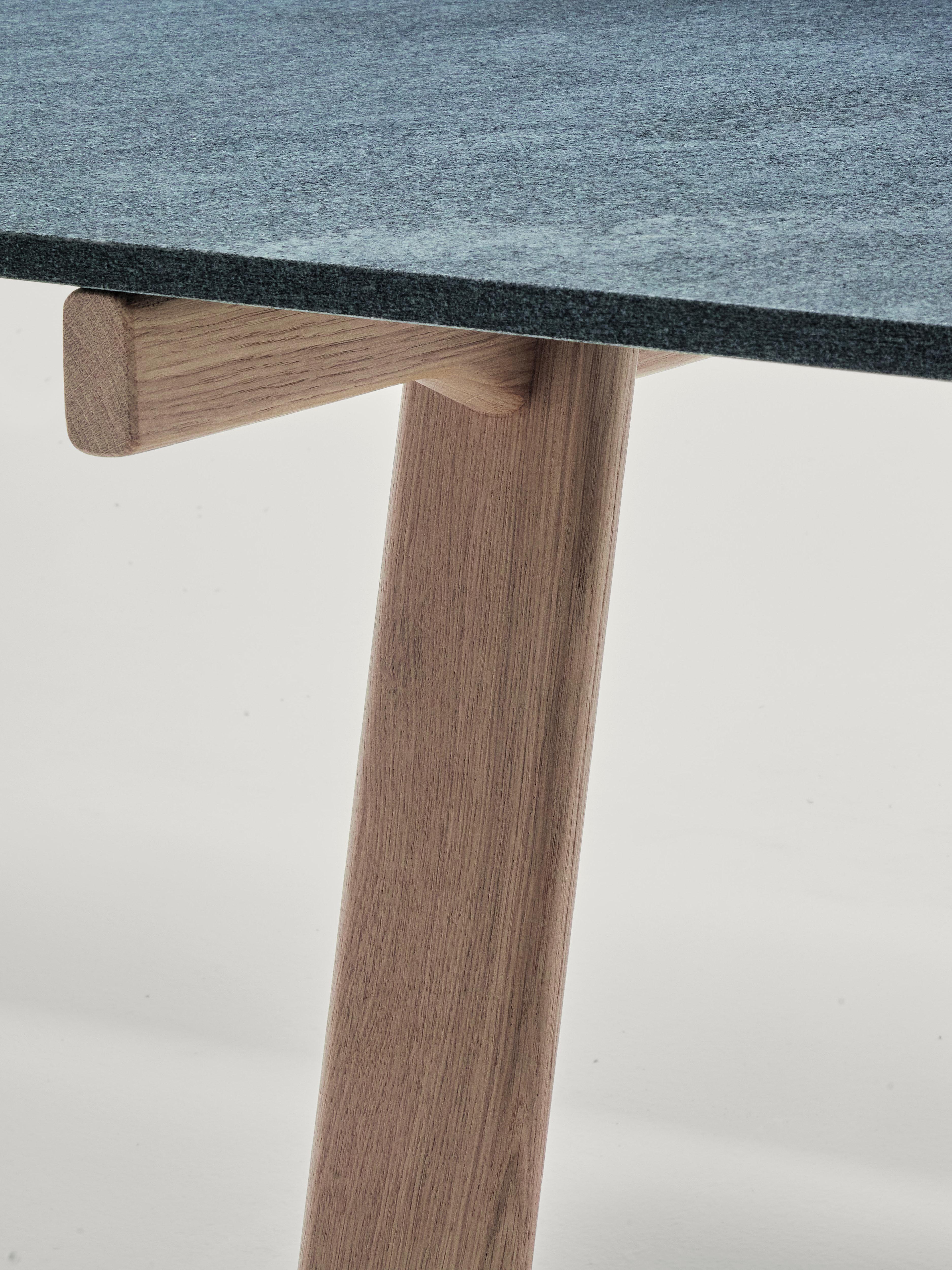 Zanotta Large Ambrosiano Table in Onsernone Stone Top with Natural Oak Frame by Mist-o

Trestles in solid natural oak or painted black with open pore. Matt black painted stainless steel spars. Top available either in 1/2” thick smoky grey tempered