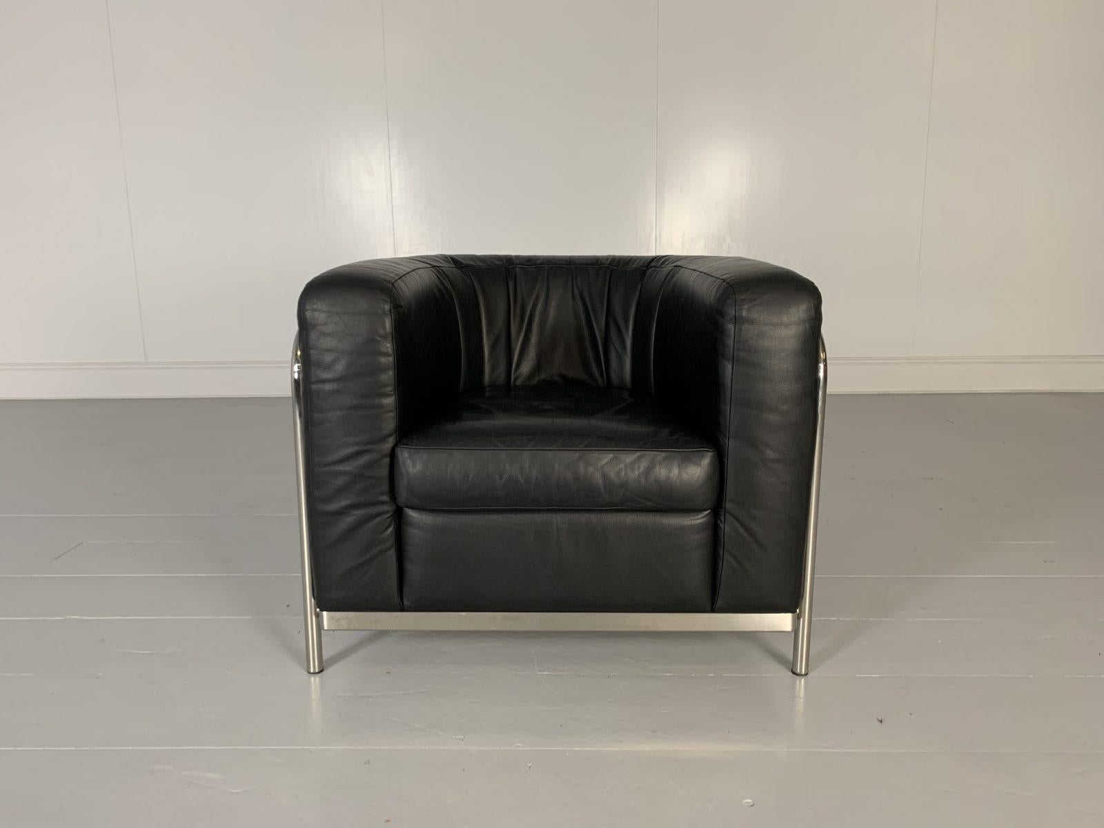On offer on this occasion is a rare, immaculately presented “Onda” Armchair from the world renown Italian furniture house of Zanotta, dressed in their legendary, incomparable “Scozia” Leather in Jet-Black, and with a polished-chrome frame.

As you