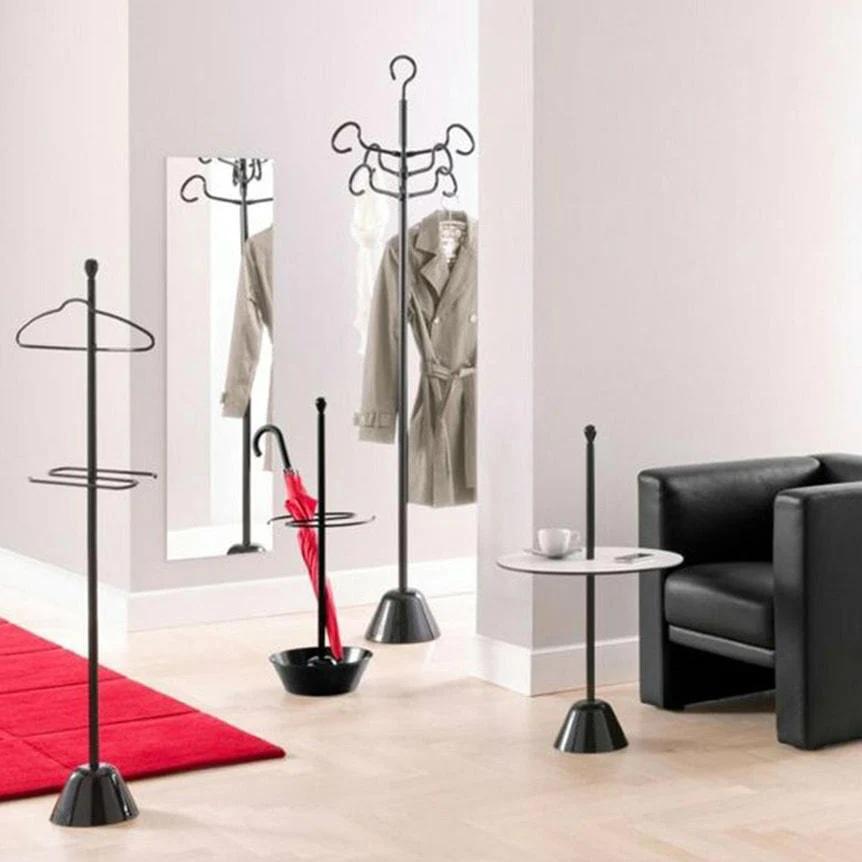 Umbrella stand. Base in polypropylene, container in aluminium and steel support frame, painted in the shade black for outdoors.