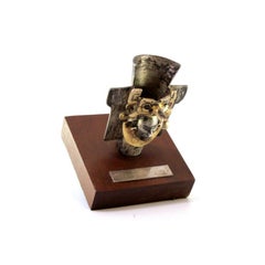 Zapotec-style silver urn with figure on monogrammed wooden base