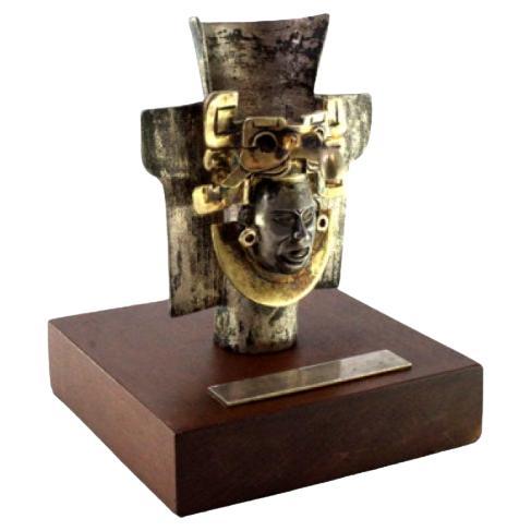 Zapotec-style silver urn with figure on monogrammed wooden base