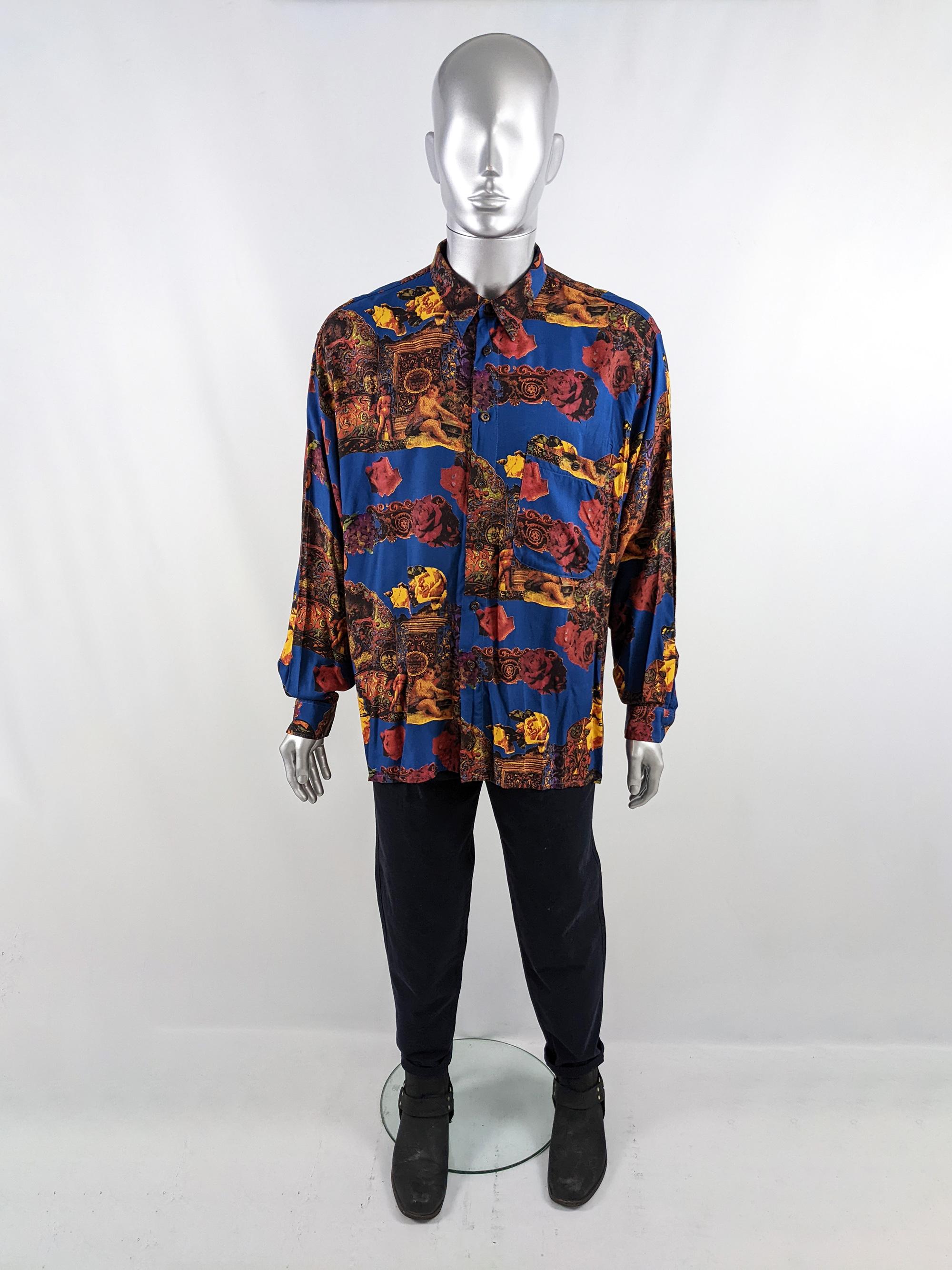 An incredible and rare vintage mens long sleeve shirt from the 80s by Zazzi. In a drapey blue viscose (rayon) with an amazing baroque print featuring cherubs and roses.

Size: Marked XL but this gives an oversized fit. Please check