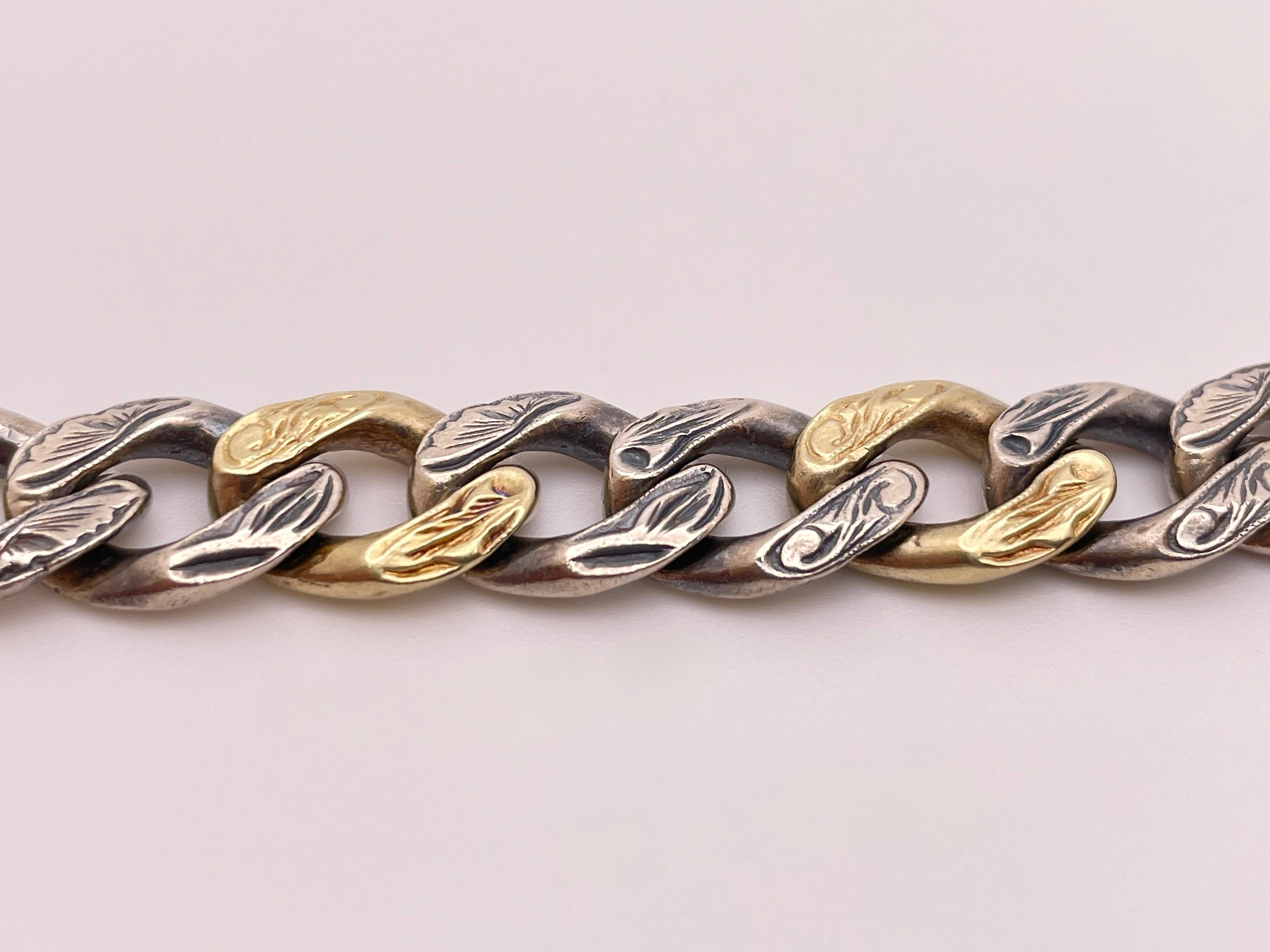 An original ZDNY Gothic 14K yellow gold and silver two-tone bracelet. Each link has a beautiful carved design. Marked 