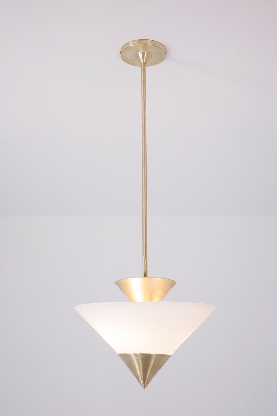 Measures: W 14in (35.5 cm) x D 14in (35.5 cm) x H 36in (91.5 cm)
Canopy: Dia 6in (15.25 cm)

The Zé pendant is inspired by the geometric elements of Art Deco. Finish options for the brass stem, canopy, and cone are either brass or matte black. The