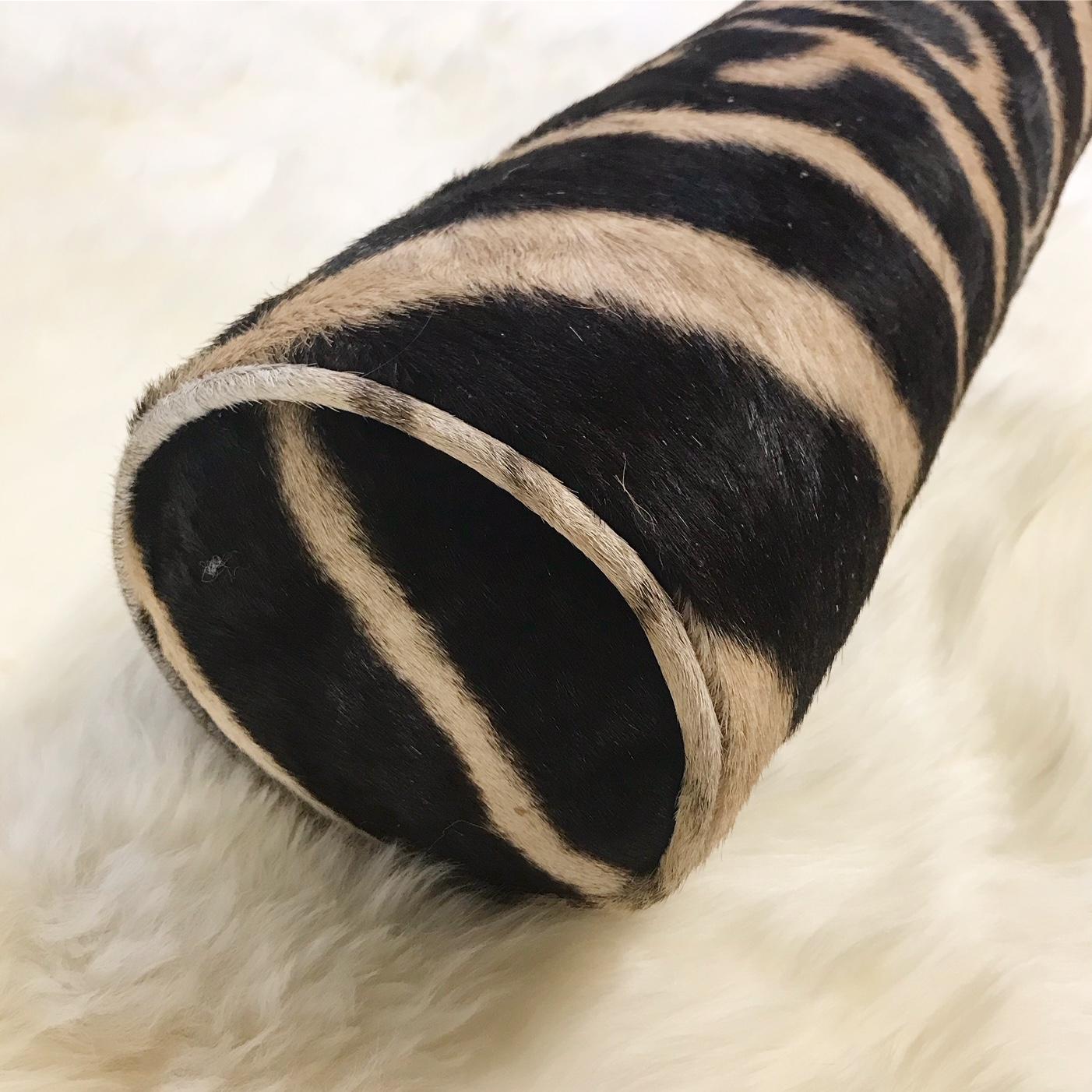 Forsyth zebra hide pillows are simply the best. The most beautiful hides are selected, hand cut, hand stitched, and hand stuffed with the finest goose down. Each step is meticulously curated by Saint Louis based Forsyth artisans. Every pillow is a