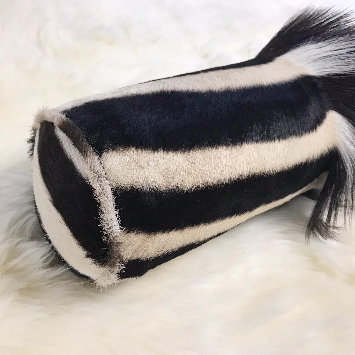 Forsyth zebra hide pillows are simply the best. The most beautiful hides are selected, hand cut, hand stitched, and hand stuffed with the finest goose down. Each step is meticulously curated by Saint Louis based Forsyth artisans. Every pillow is a