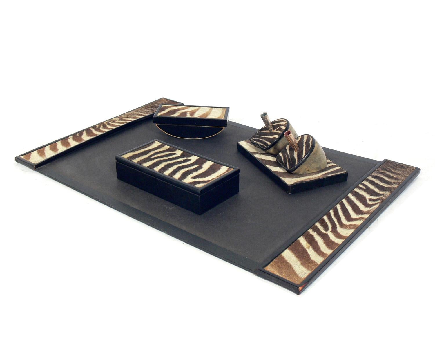 Zebra hide desk set, circa 1950s. The desk pad measures 26