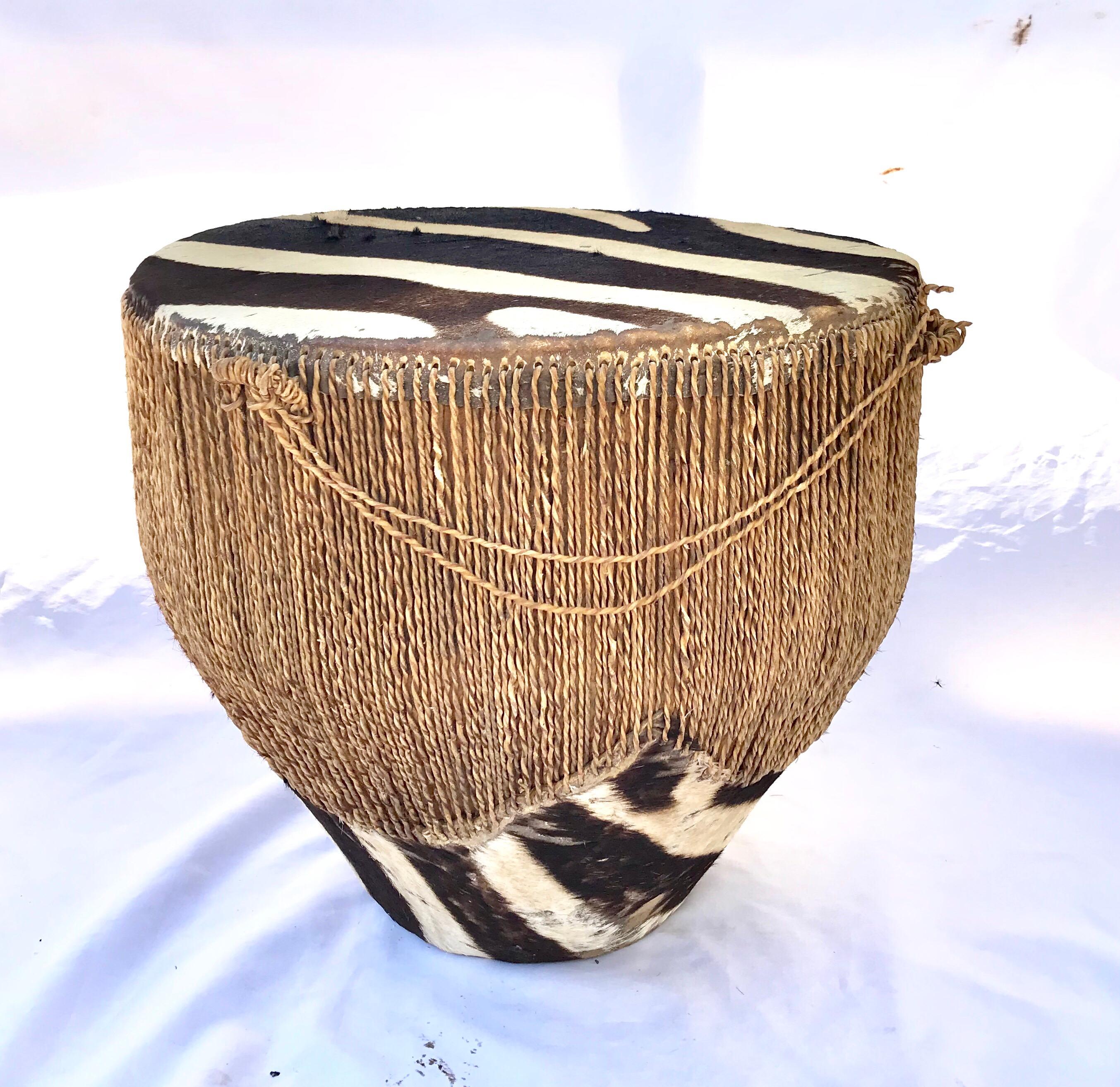 A spectacular vintage drum side table in zebra hide. A necessity for the global boho-chic curated life.