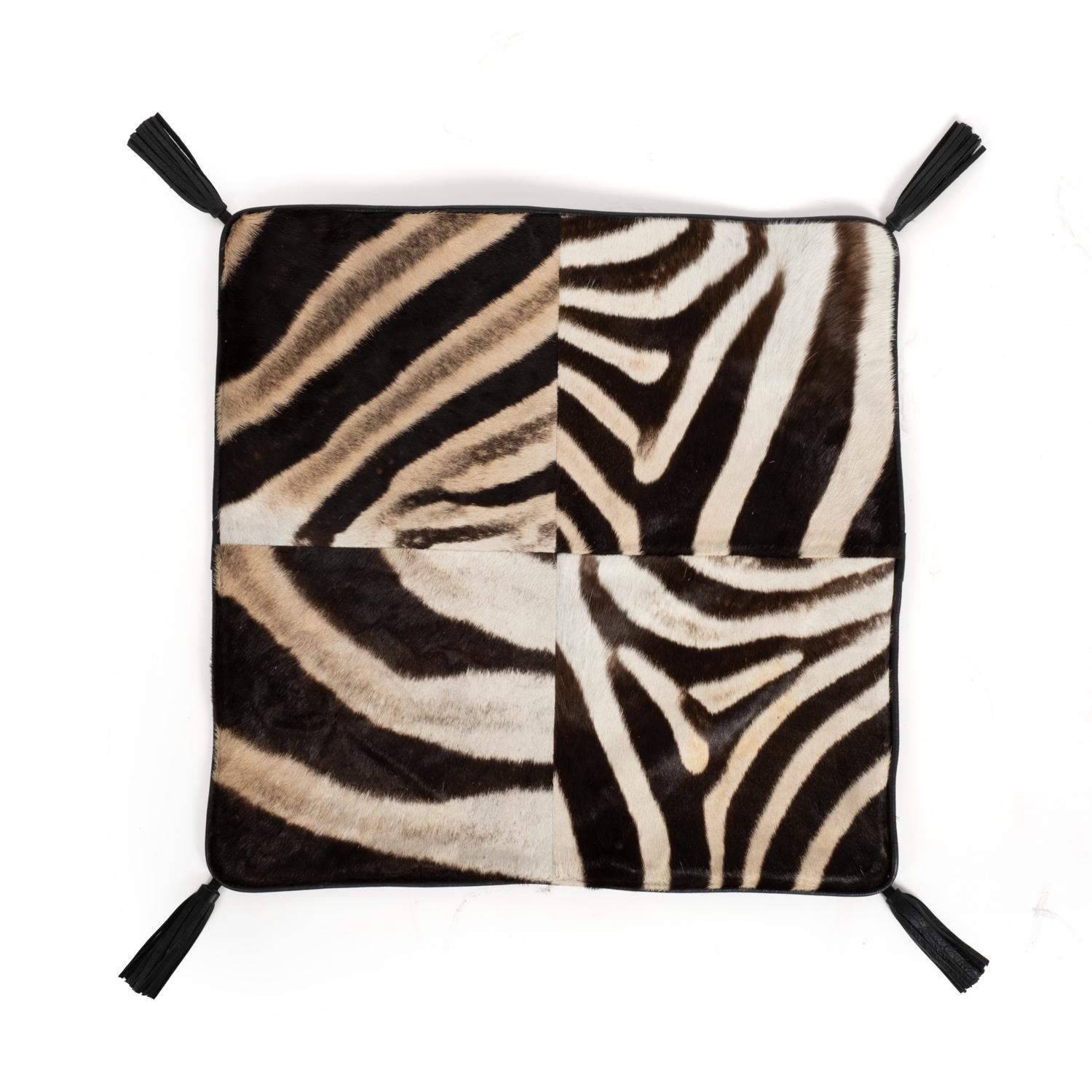 Effortlessly blending textures and natural materials, this pillow is handcrafted of ethically and sustainably sourced Zebra Hide with solid natural linen fabric on the reverse. A feather-and-down insert ensures long-lasting comfort. Due to the use