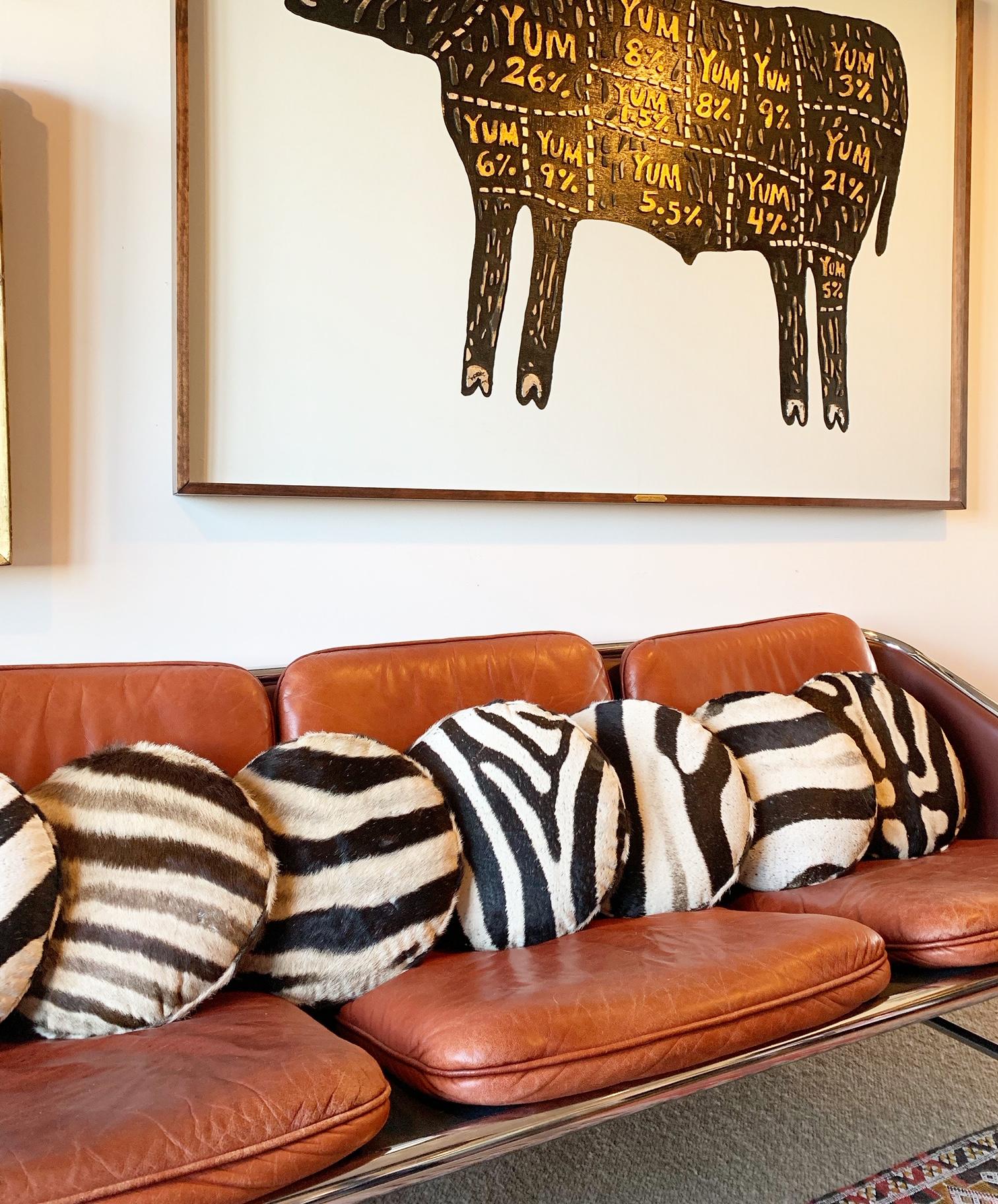 Our zebra hide squab pillows are handcrafted from our beautiful Forsyth zebra hides. The most beautiful zebra hides are selected, handcut, handstitched, and hand stuffed with the finest insert. Each step is meticulously curated by Saint Louis based