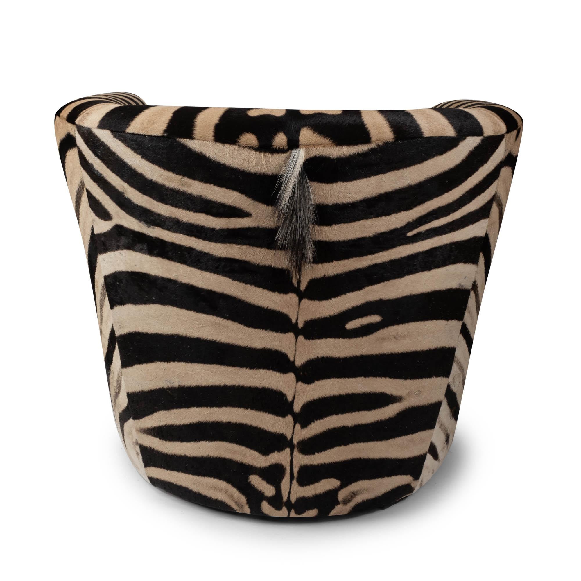 Genuine zebra hide creates an occasional chair sure to make a statement. Each chair requires two full hides to upholster and manufacture making every chair one-of-a-kind. Due to the use of natural materials, each piece is unique and may vary