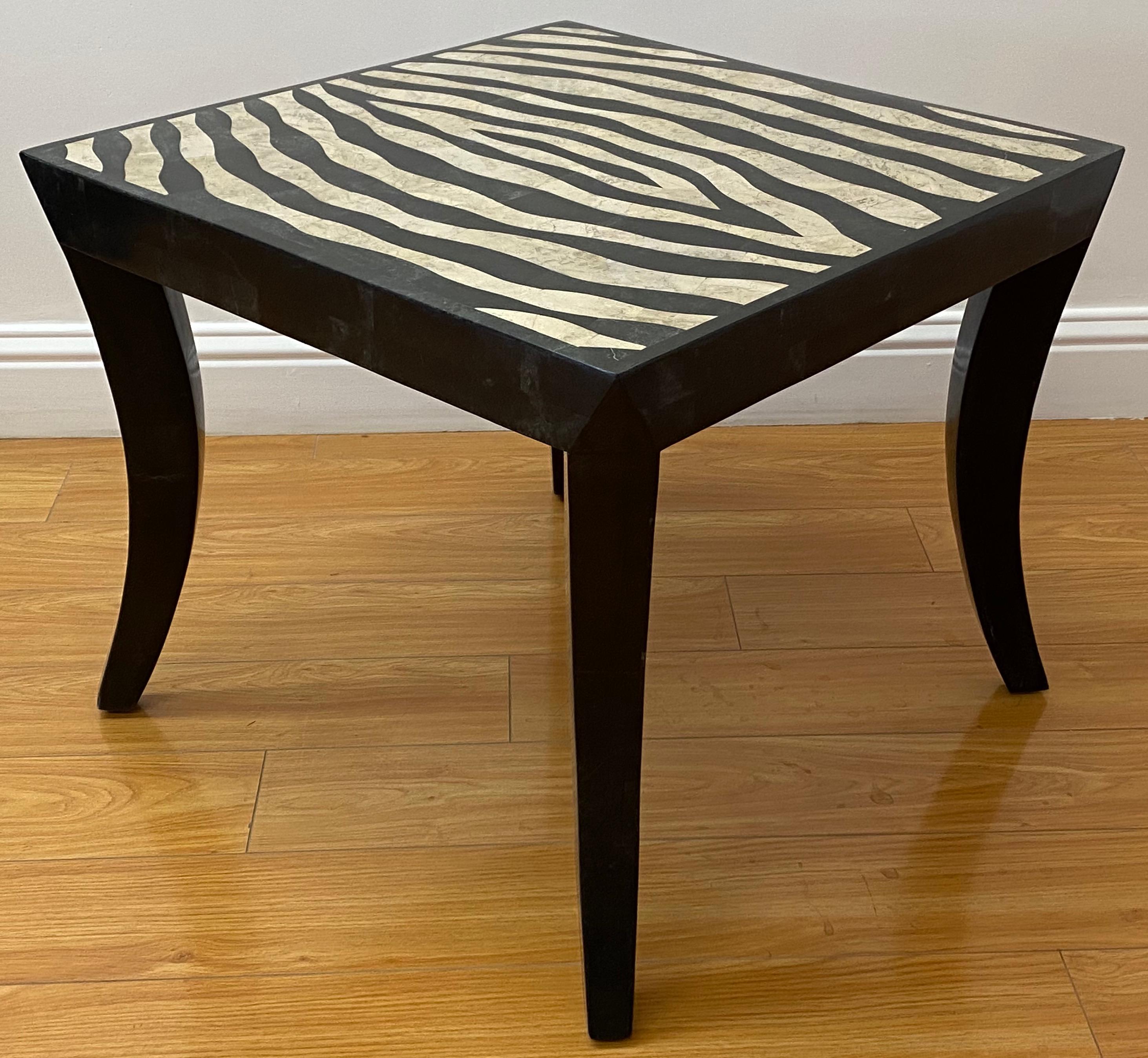 Zebra pattern stone inlay side / coffee table

Nice vintage coffee / side table with stone inlay over black lacquer

Measures: 24