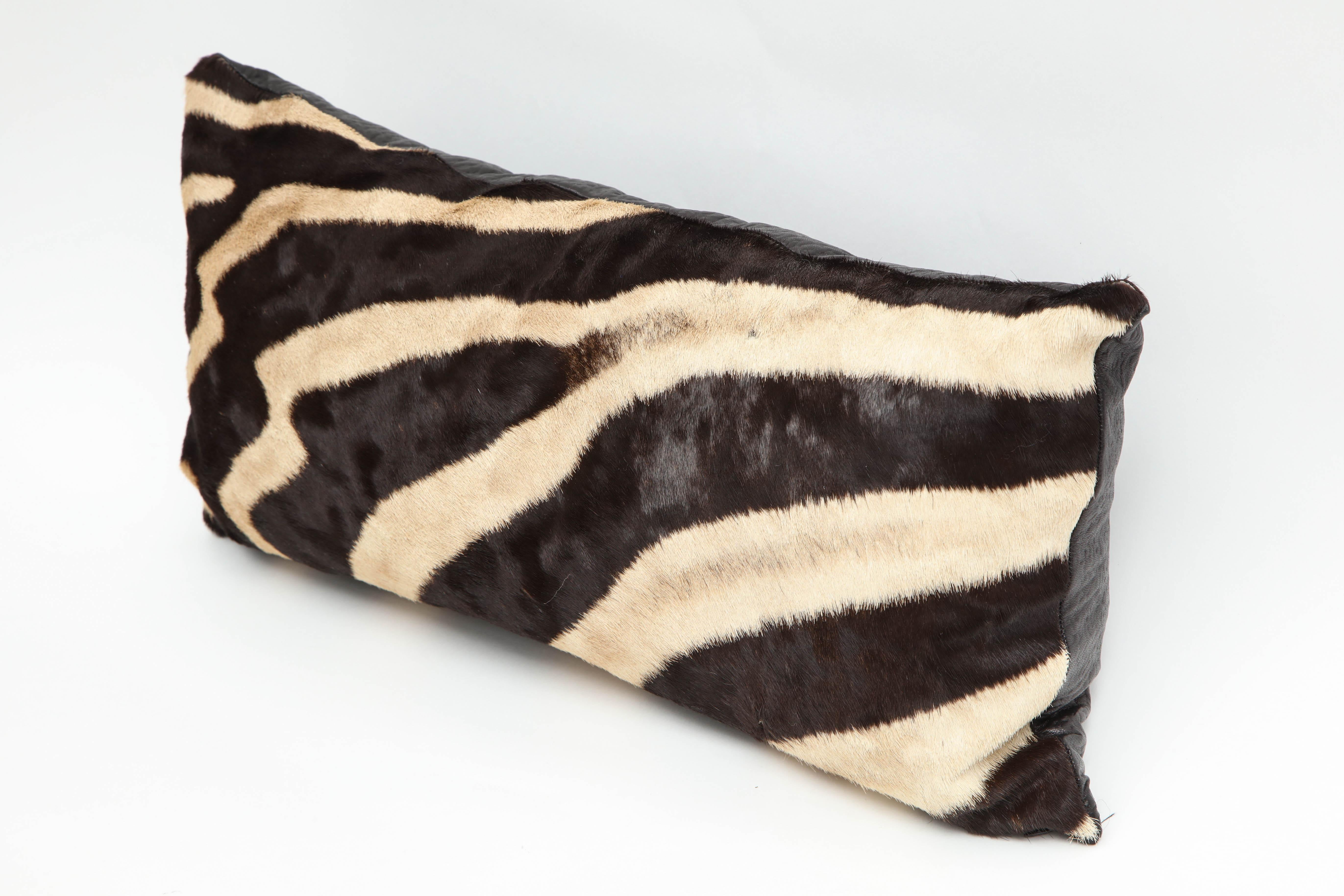 Zebra pillow. Measures: 20 inches by 10 inches. Zebra hide is from South Africa.
This pillow is sold but we have another one, very similar.
