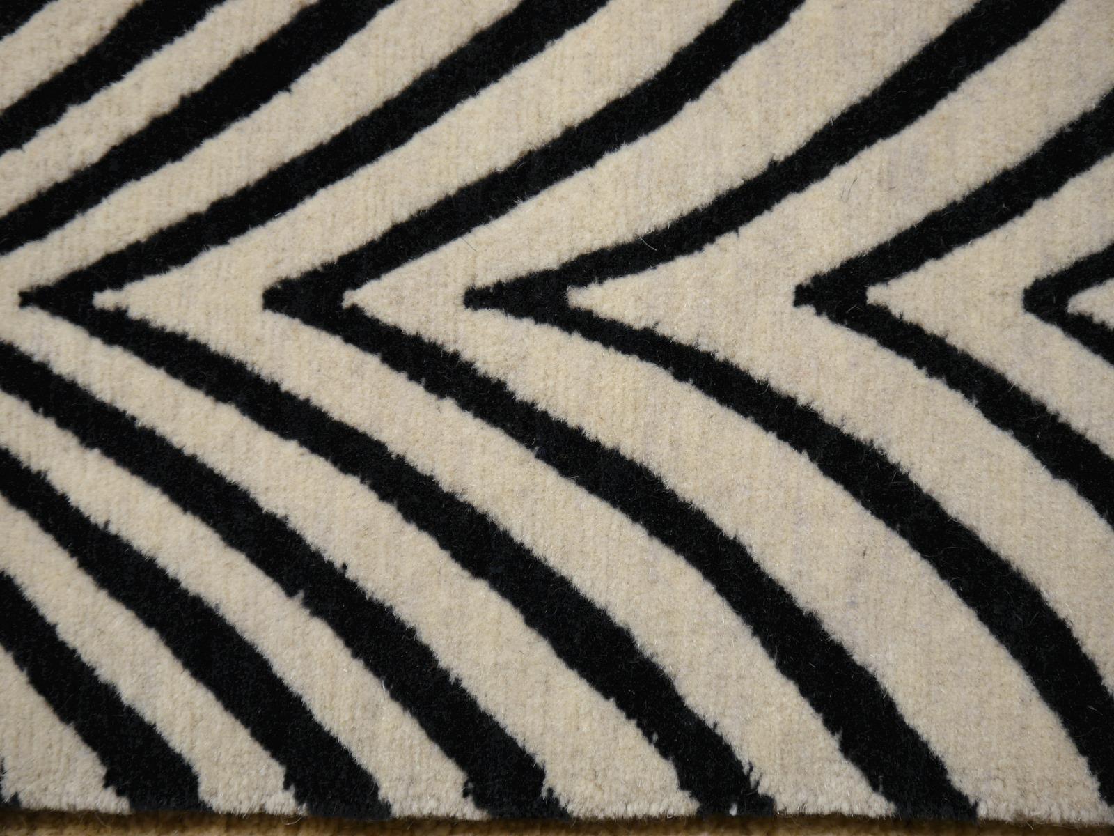 A Zebra design rug, contemporary production, in style of Art Deco, hand knotted, using finest Tibetan highland wool.

Very fine wool and quality. 

Current production, other sizes can be made on order.

A real eye catcher. The zebra pattern on