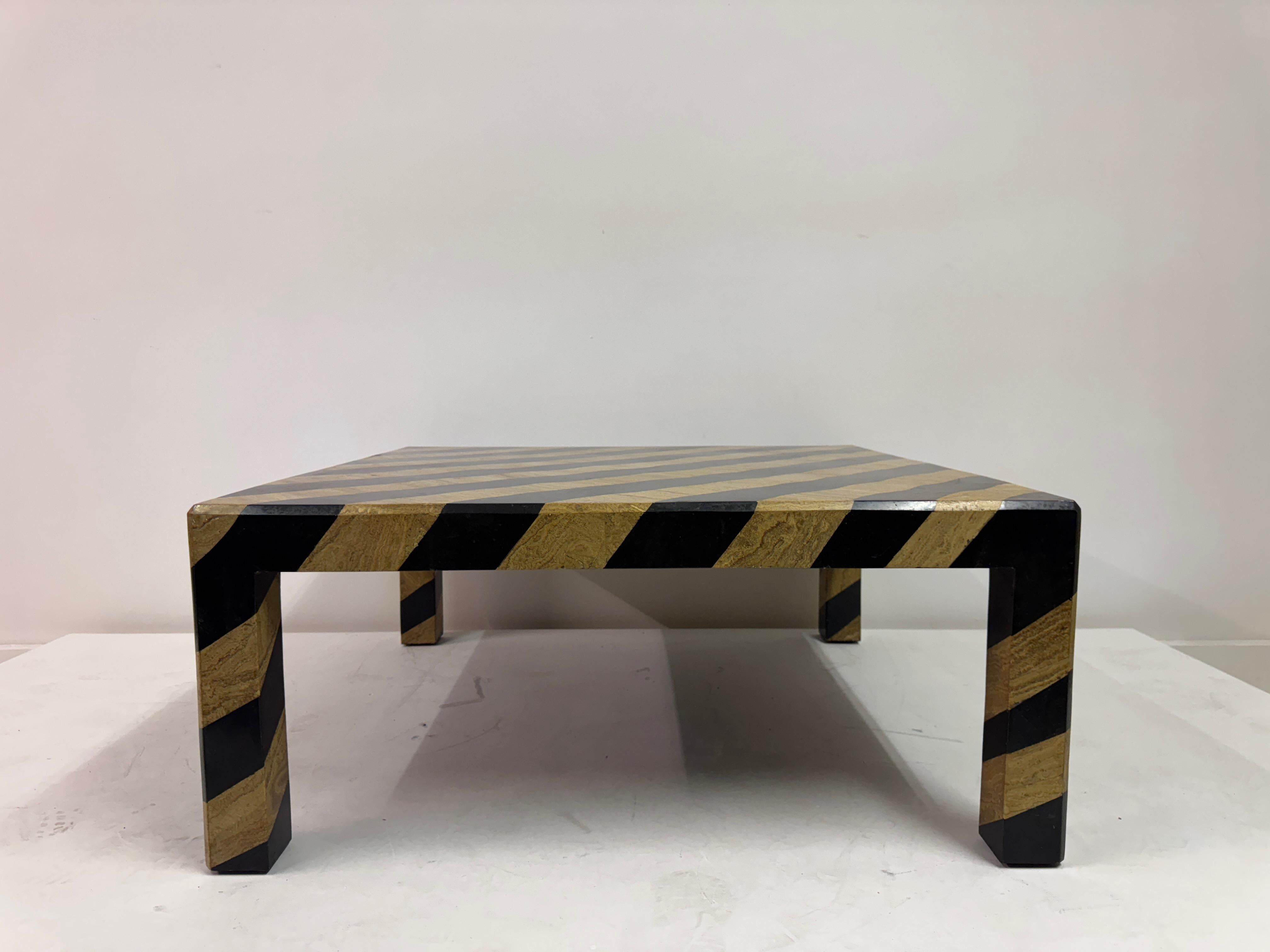 Zebra-Striped Tessellated Marble Coffee Table by Maitland-Smith, 1980s

A bold and sculptural coffee table by Maitland-Smith, crafted in tessellated stone with dramatic zebra-like striping in black and golden marble. The pattern wraps seamlessly