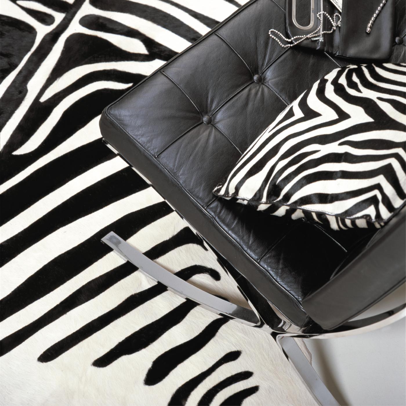 Pony-look finishing cow leather carpet with animal shape, zebra print and colored background.