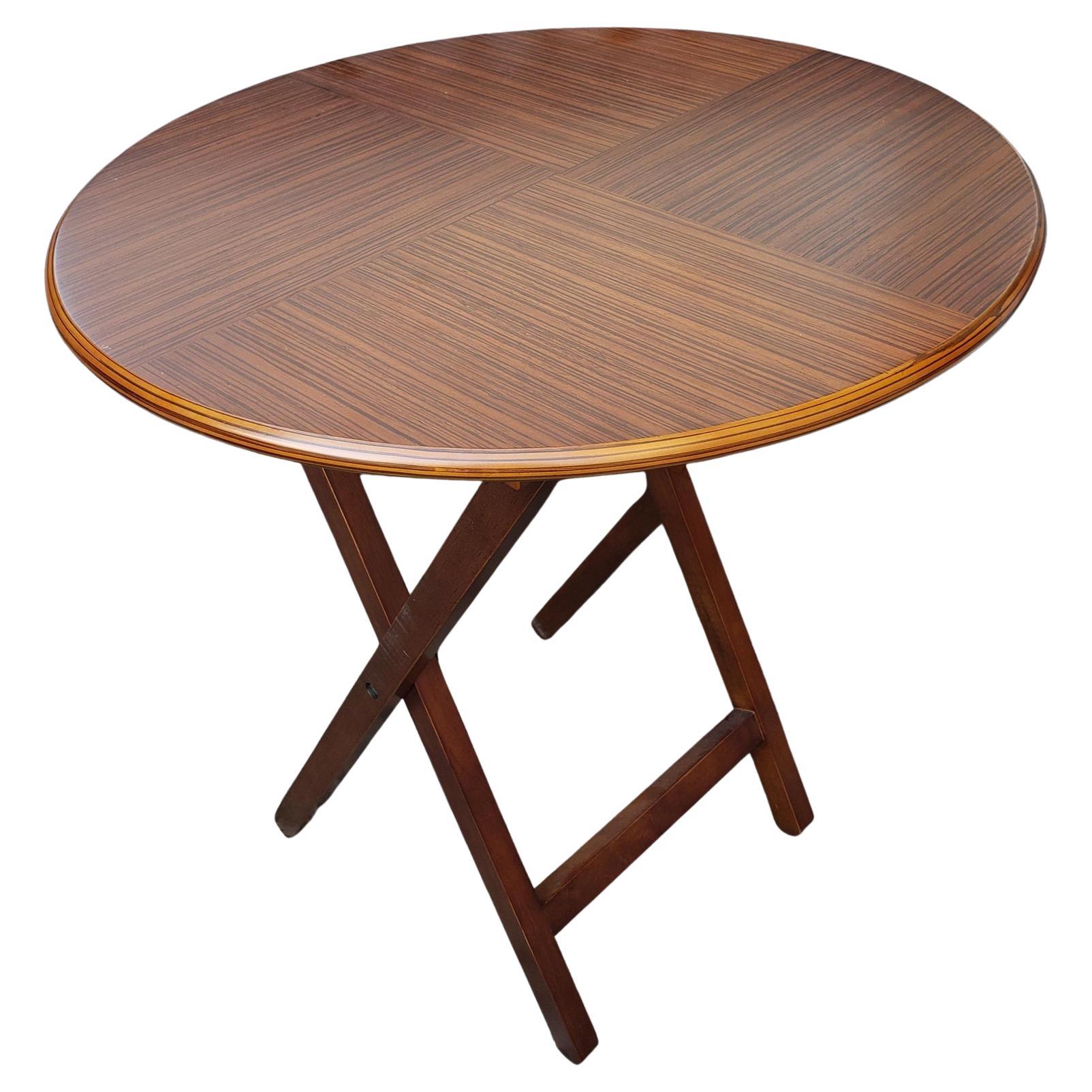 A contemporary zebra wood book matched top table with folding cross legs that can be used as center table, side table, or game table. The table has a beautiful modern look that can work with both contemporary and traditional designs. It measures