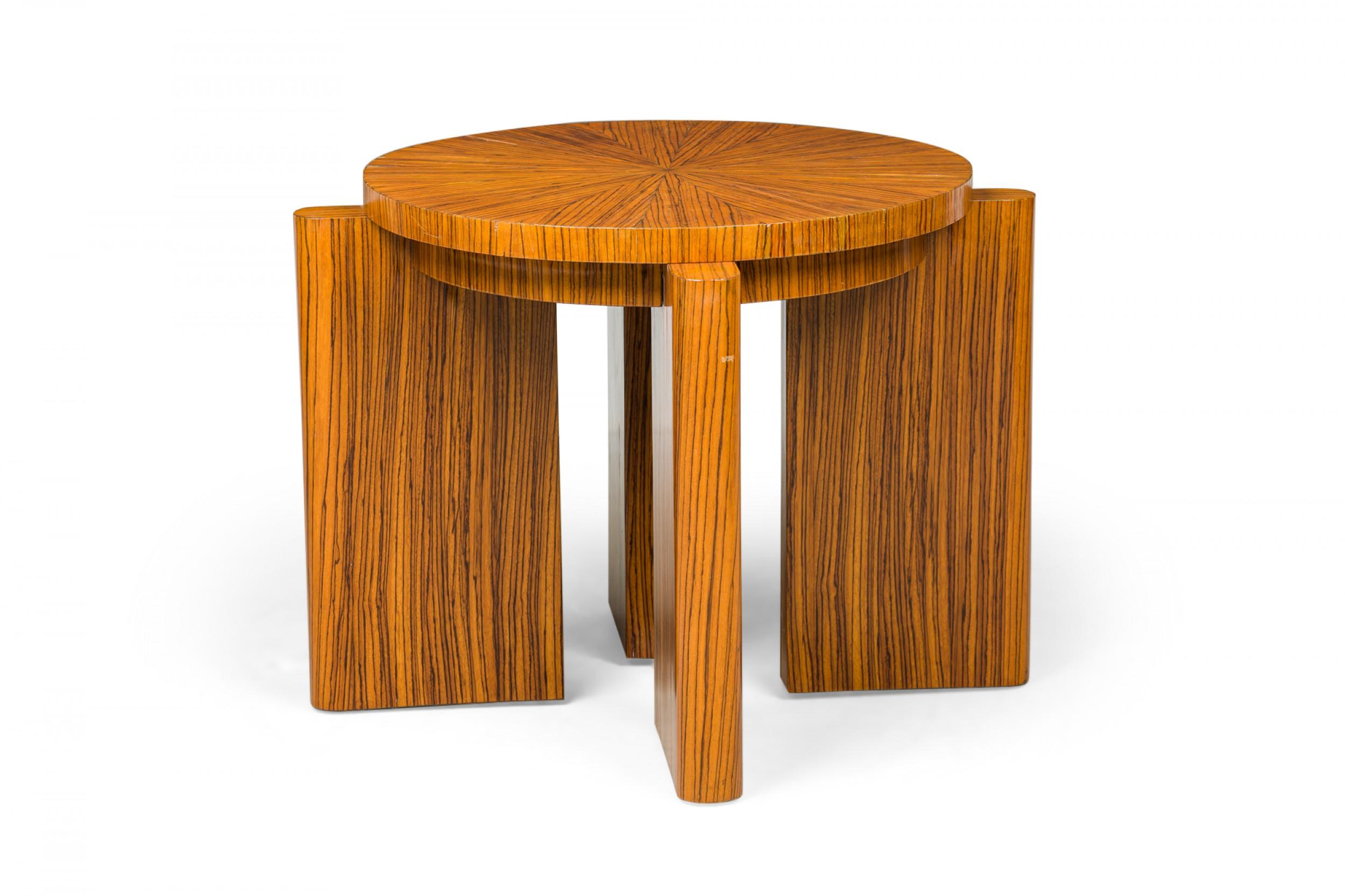 Mid-Century American (1970s) occasional end / side table finished in zebrawood veneer with a circular top resting on four wide angled legs with rounded edges, with 4 matching wedge stools that nest beneath the tabletop. (PRICED AS Set) (attributed