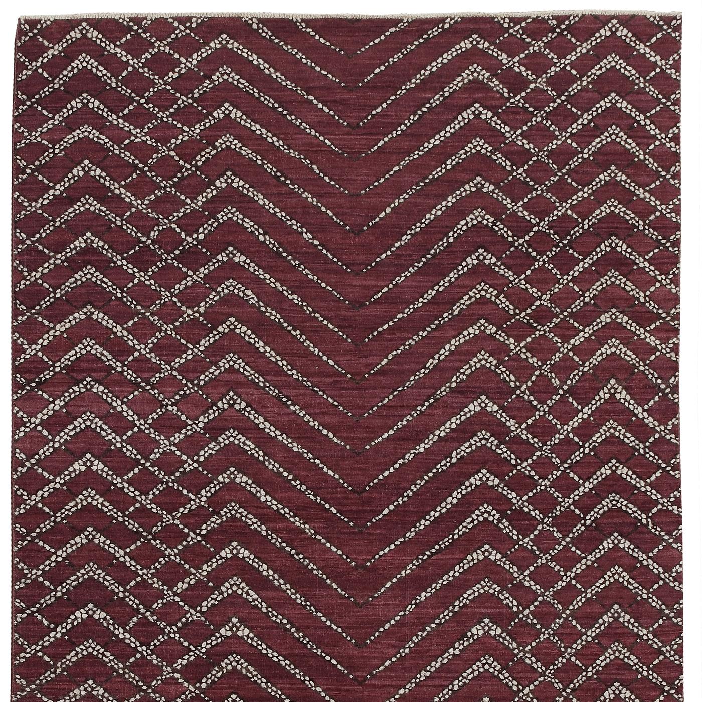 This exquisite carpet was hand-knotted using 100% wool. The design is by Allegra Hicks for Alberto Levi Gallery and it uses the same color palette and decoration of the other Zebrano piece in this same series, only reversed. So where the background